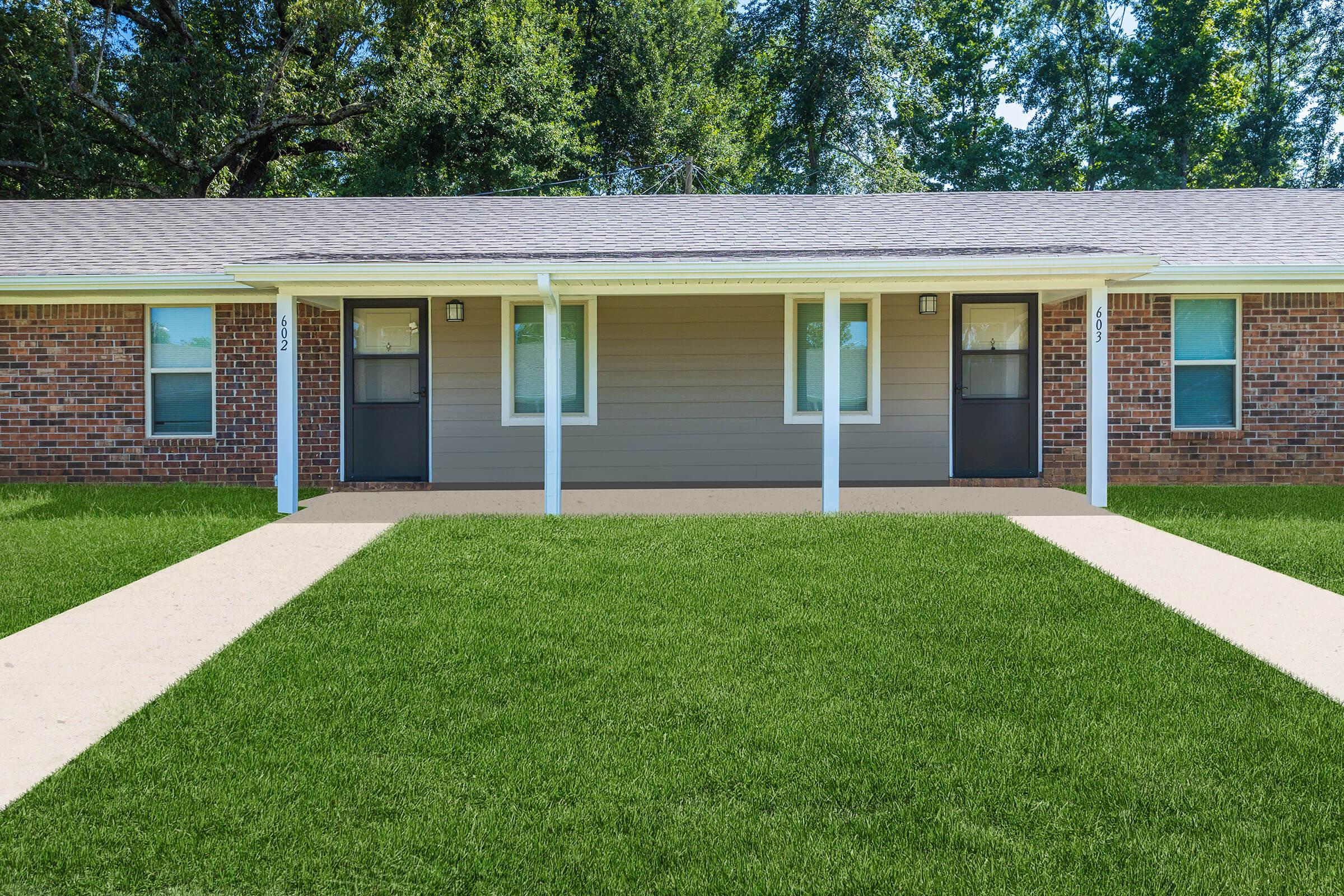 a large lawn in front of a house