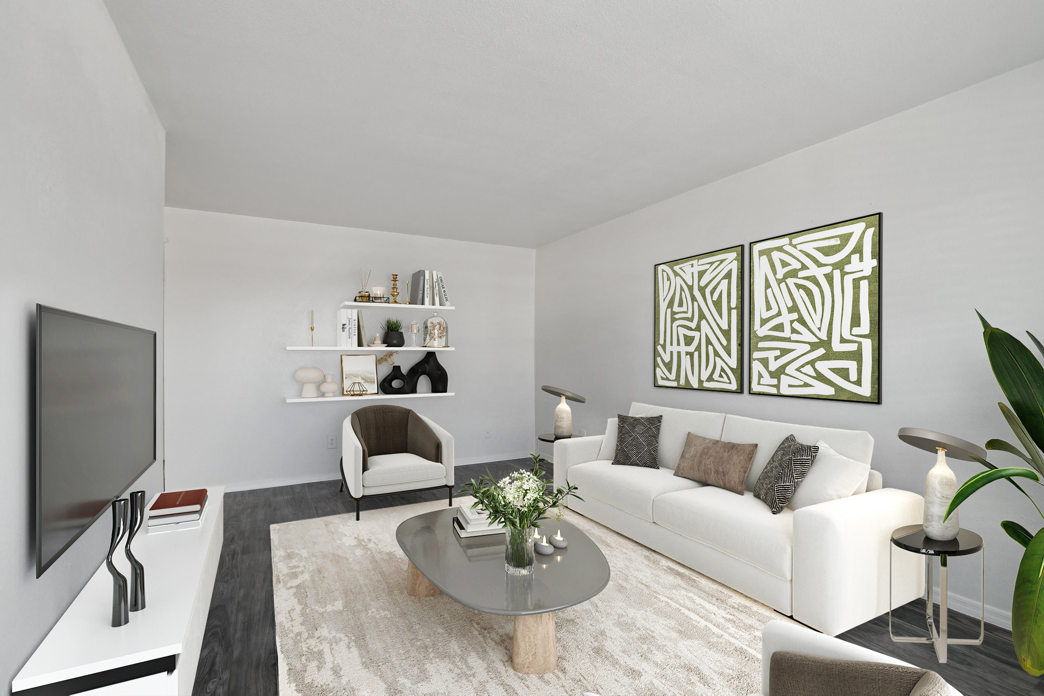 A modern living room featuring a white sofa with decorative pillows, an accent chair, a stylish coffee table, and a flat-screen TV on a sleek console. The walls are adorned with abstract art, and a shelf displays decorative items. There's a lush plant and a soft area rug, creating a cozy atmosphere.