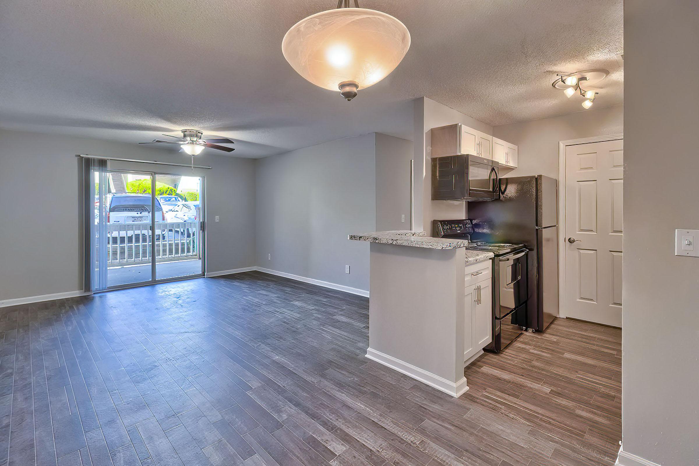 a kitchen area with a building in the background