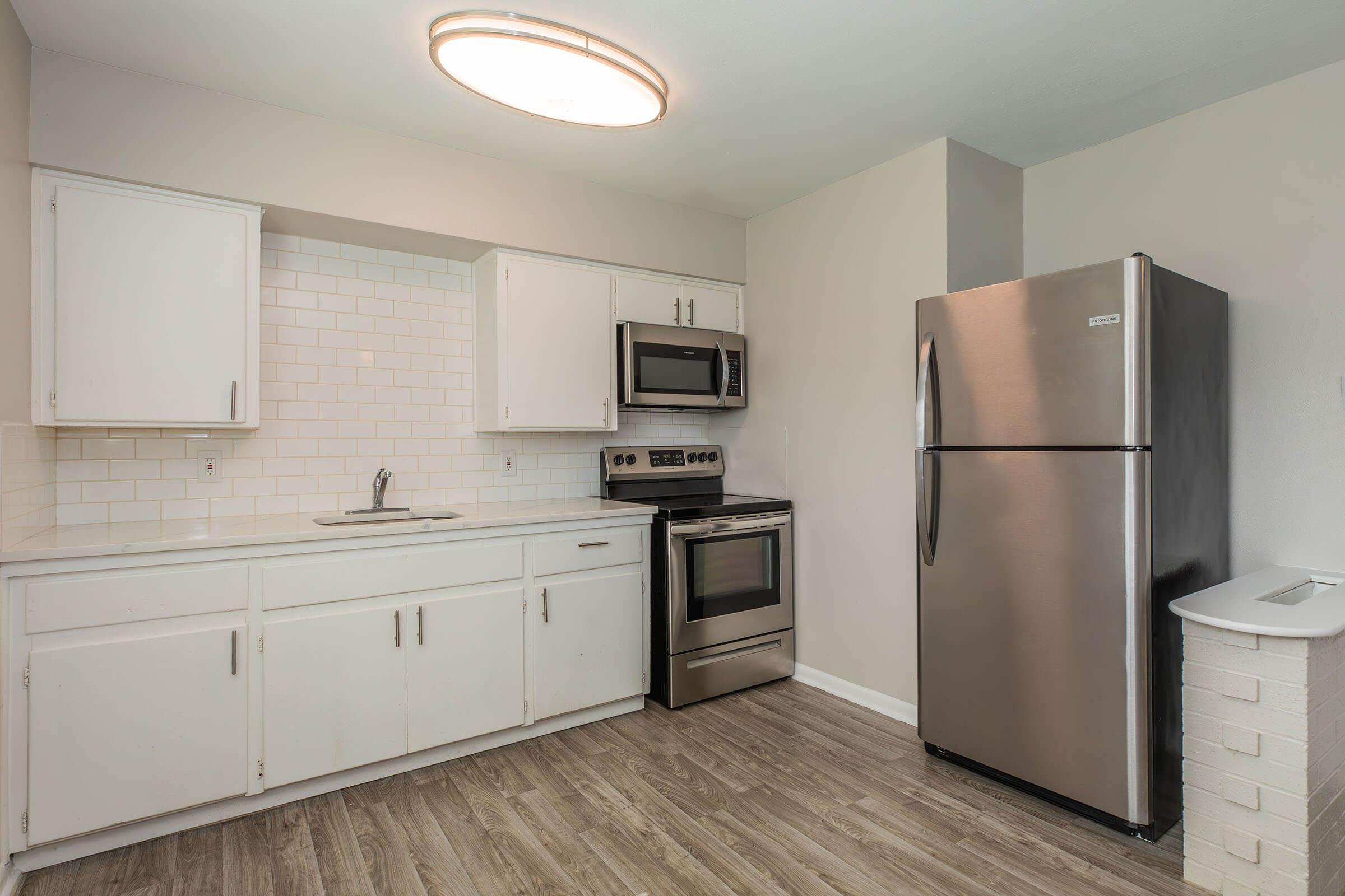 a stainless steel refrigerator in a kitchen