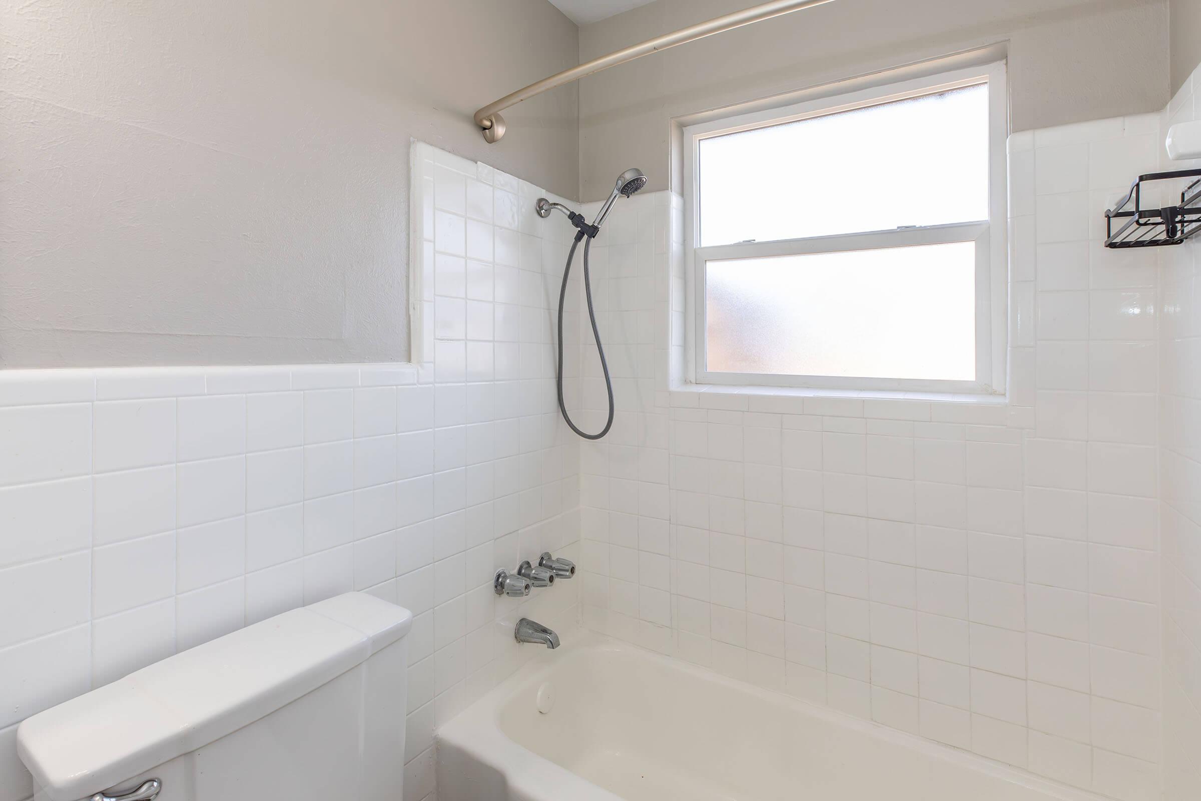 a sink sitting under a window