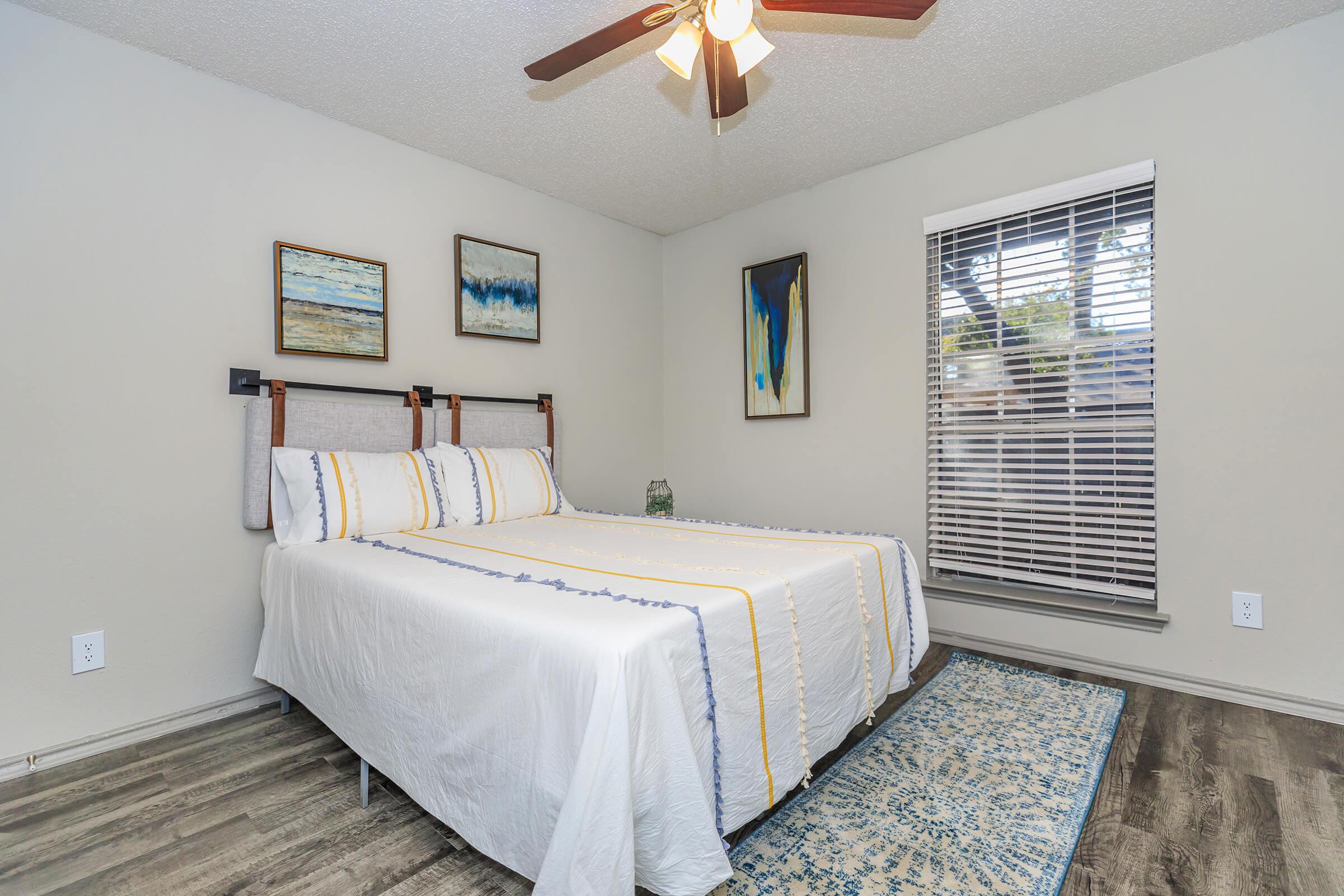 a bedroom with a bed in a room