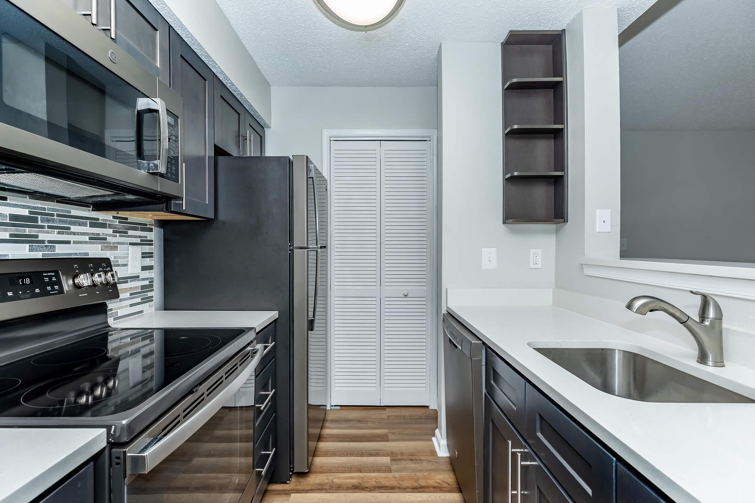 a modern kitchen with stainless steel appliances