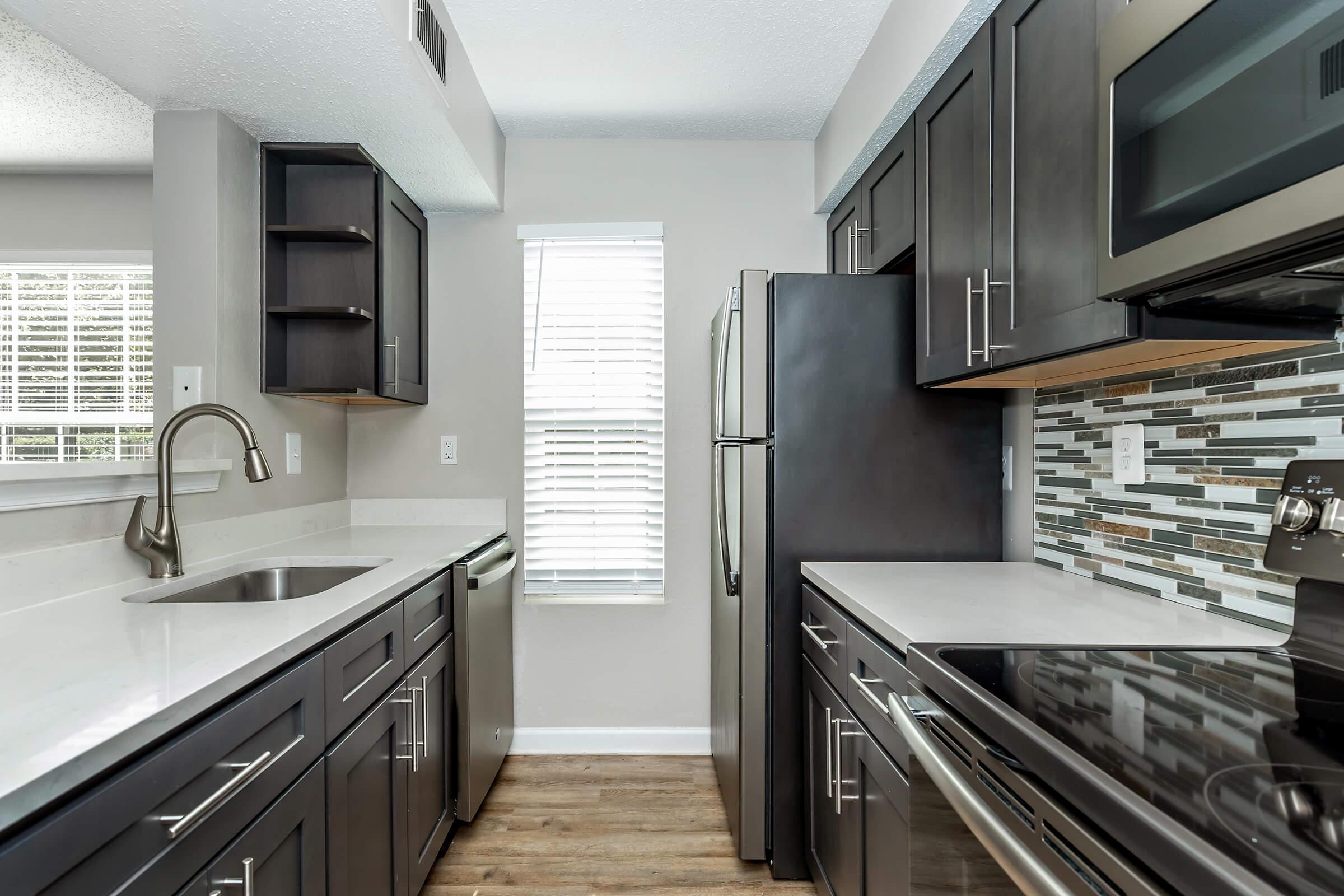 a large kitchen with stainless steel appliances