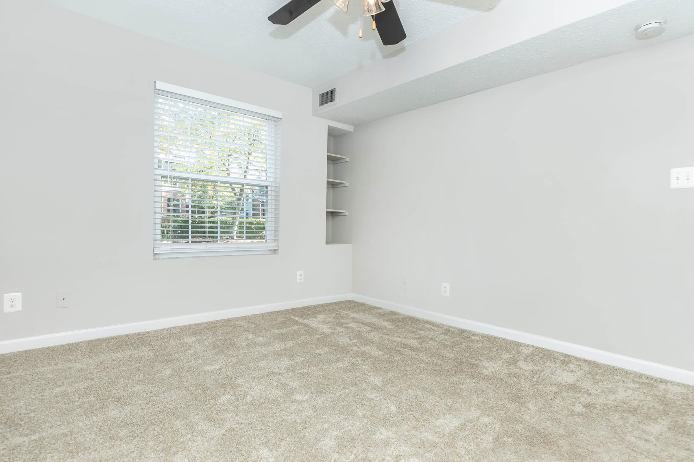 a bedroom with a large window