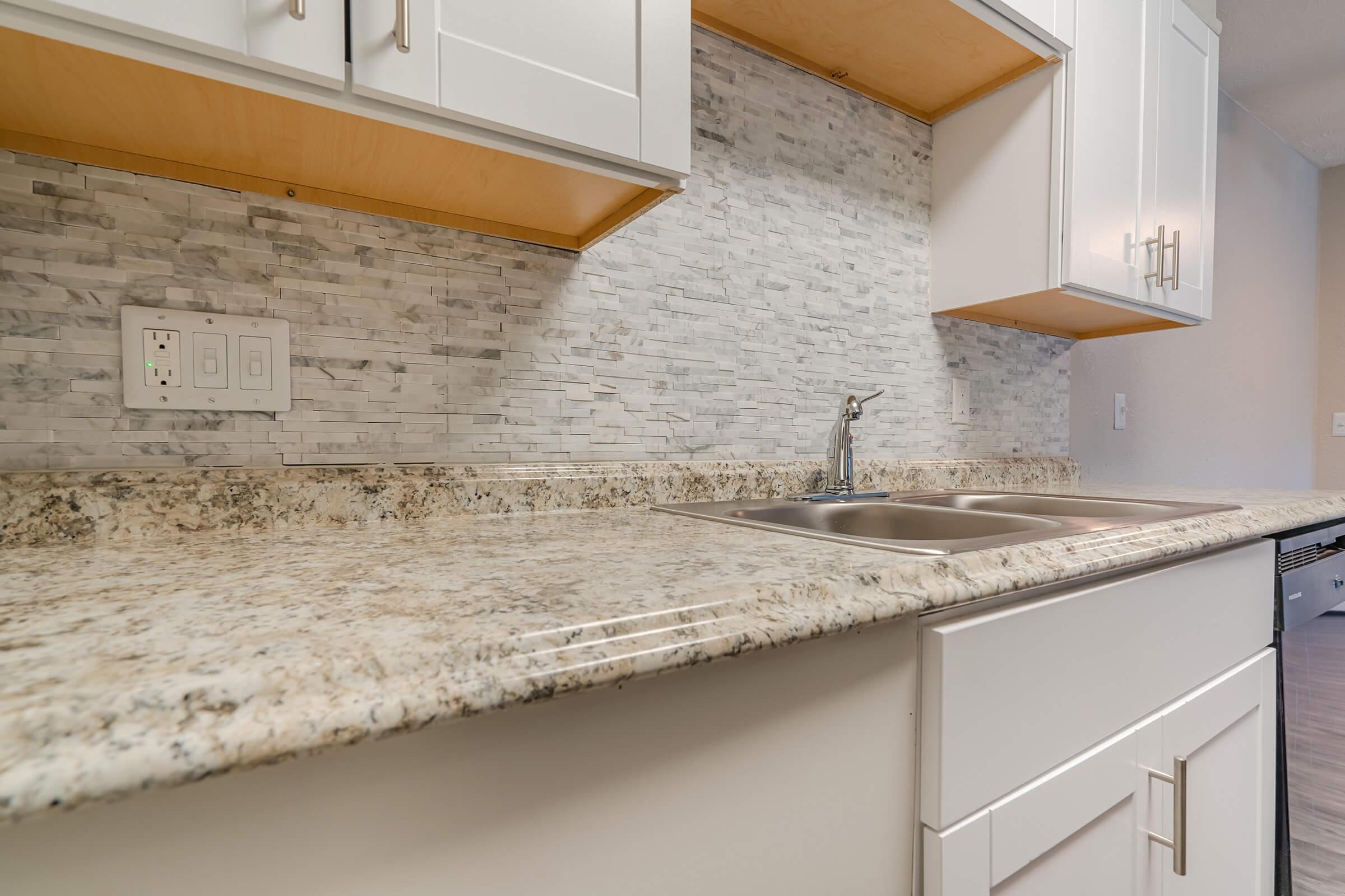 a kitchen with a sink and a window