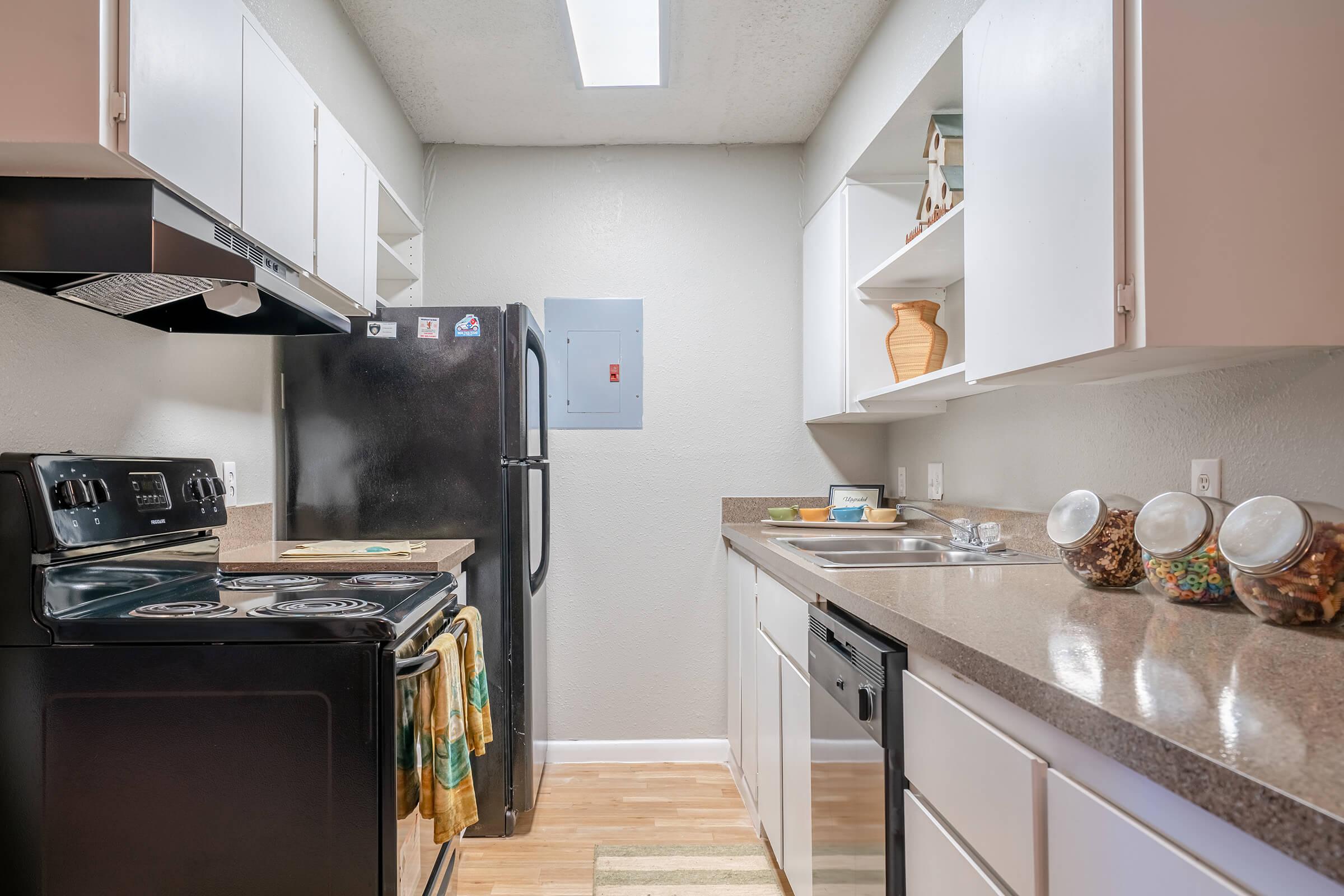 a kitchen with a stove and a sink