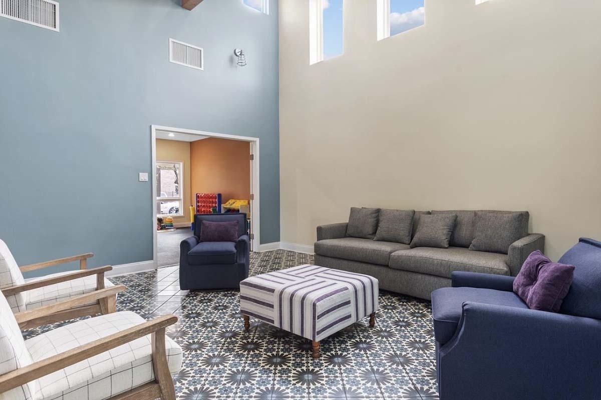 a living room with a leather chair