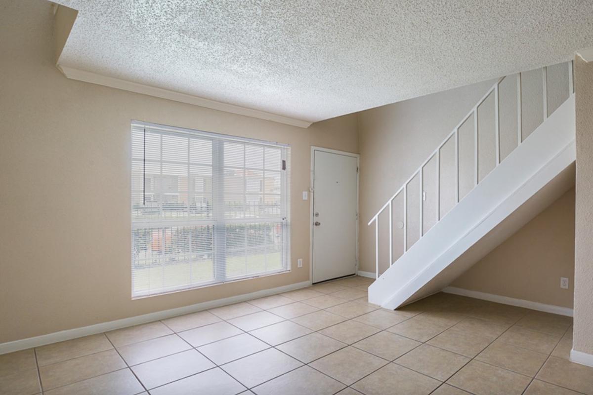 a view of a tiled floor next to a window