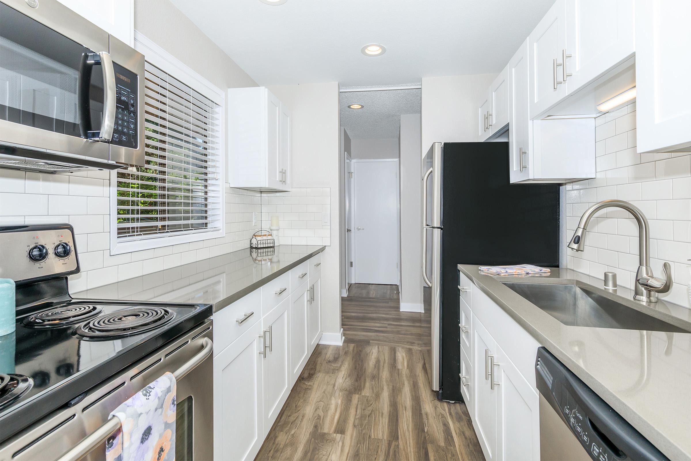 a kitchen with a sink and a window