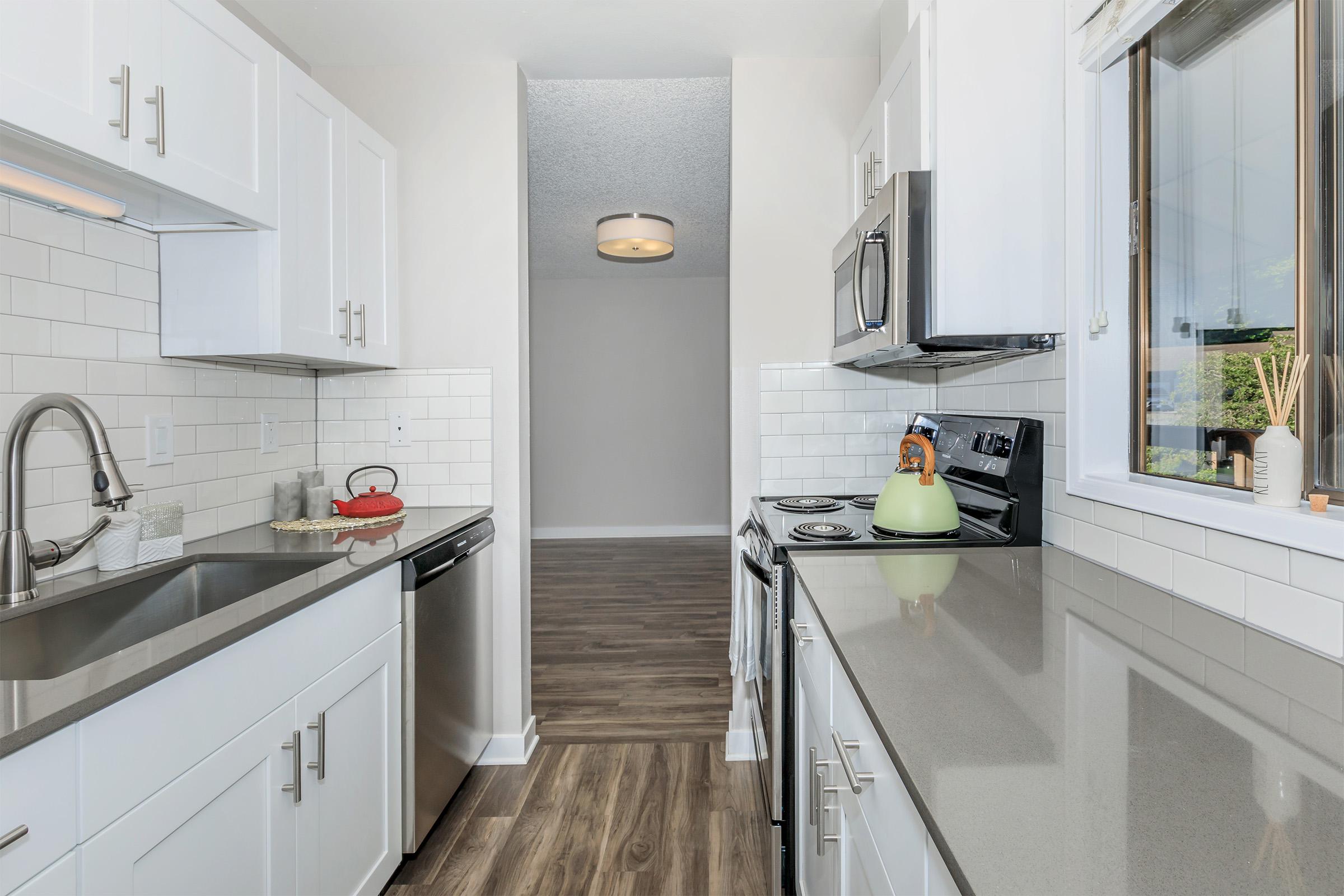 a kitchen with a sink and a window