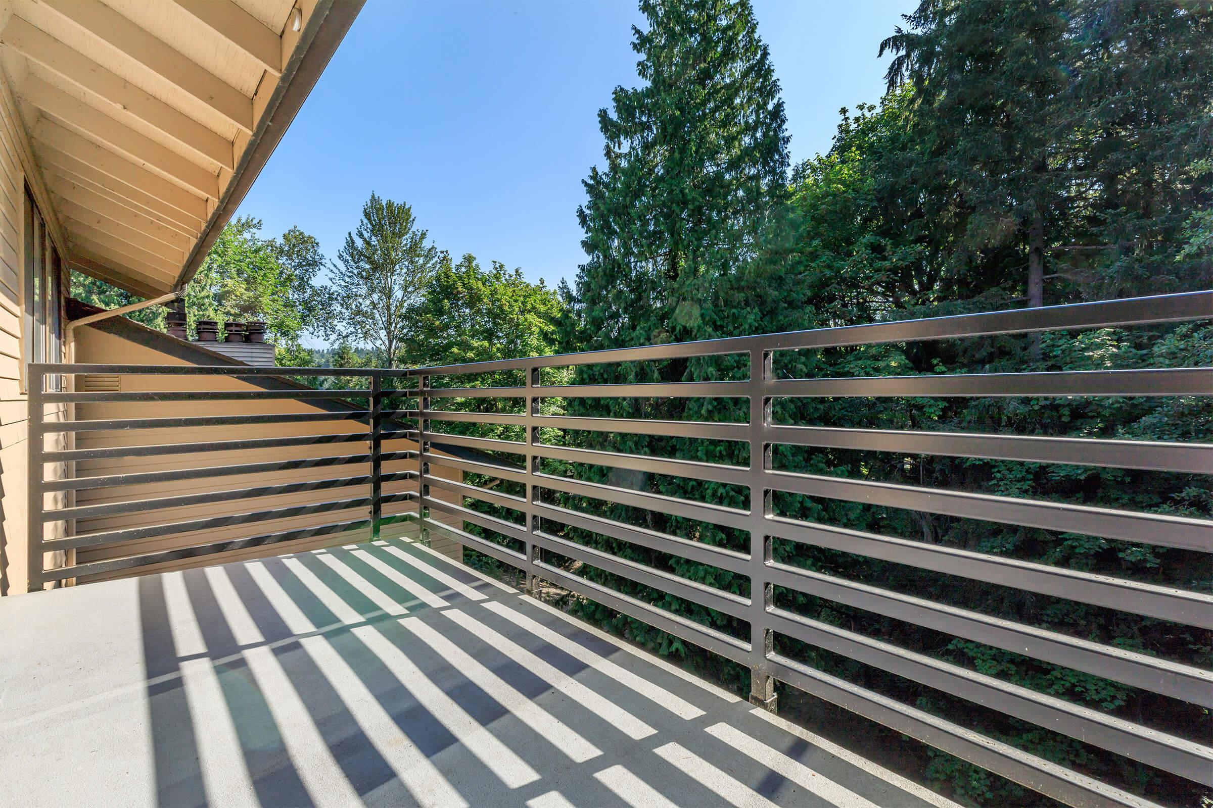 a wooden bench sitting next to a fence