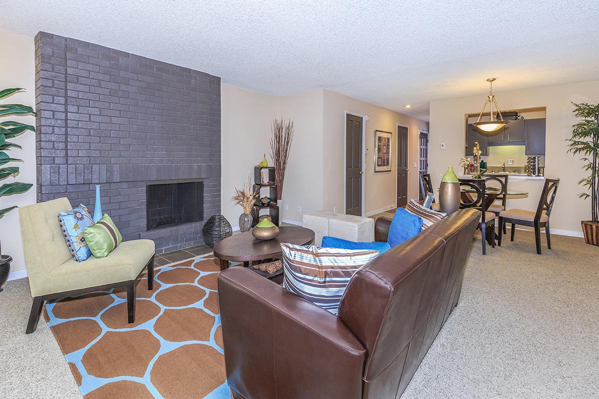 a living room filled with furniture and a fire place