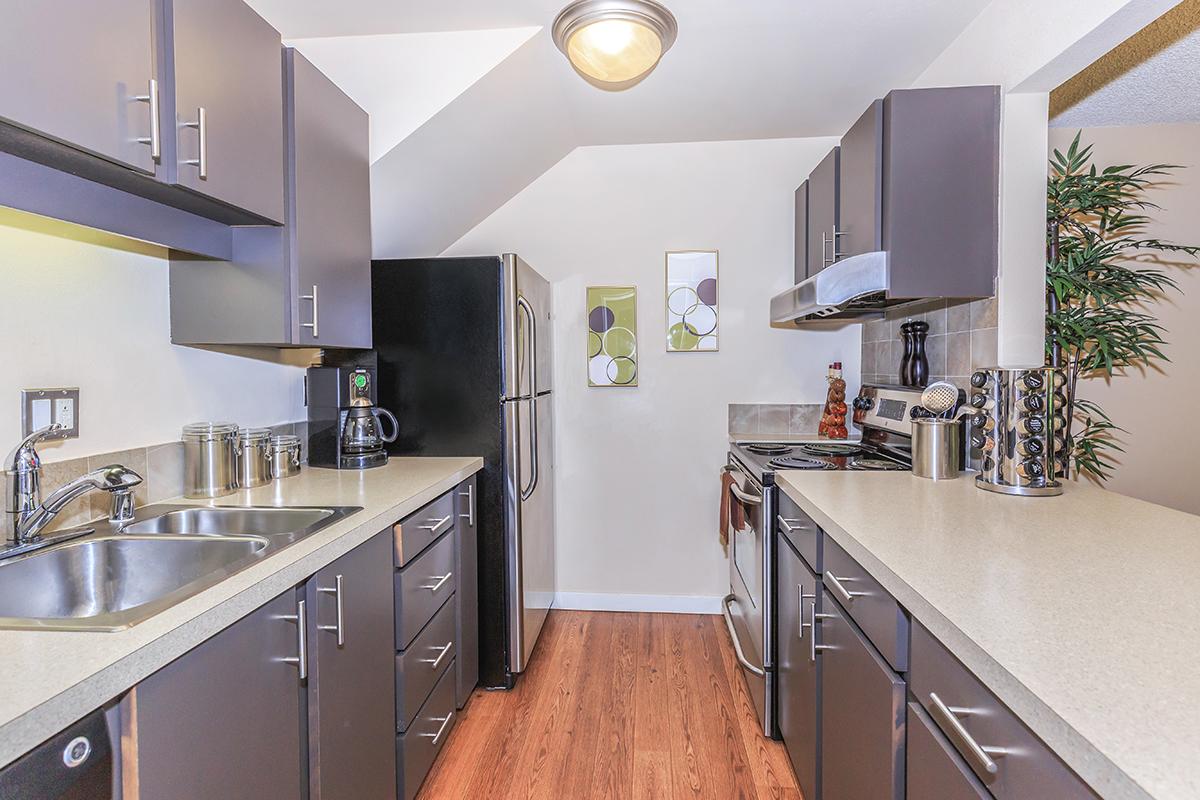 a large kitchen with stainless steel appliances