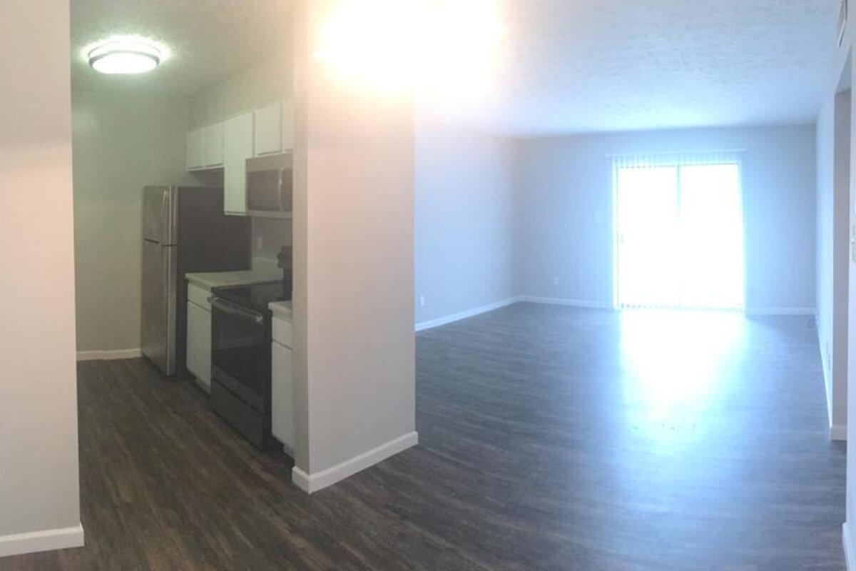 a large empty room with a wooden floor