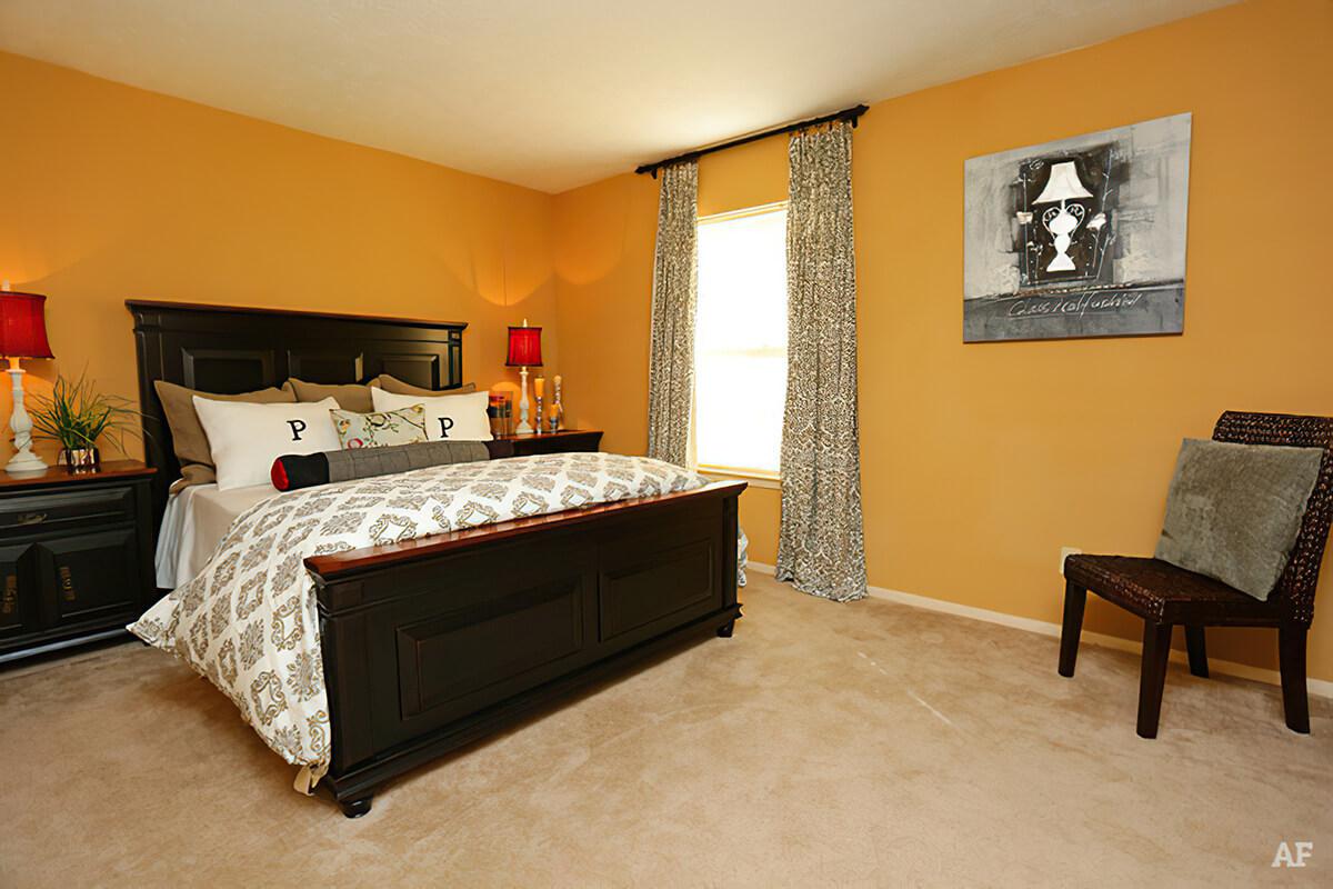 a living room filled with furniture and a fireplace
