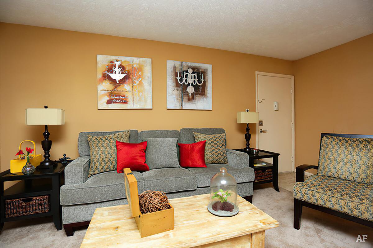a living room filled with furniture and a fire place