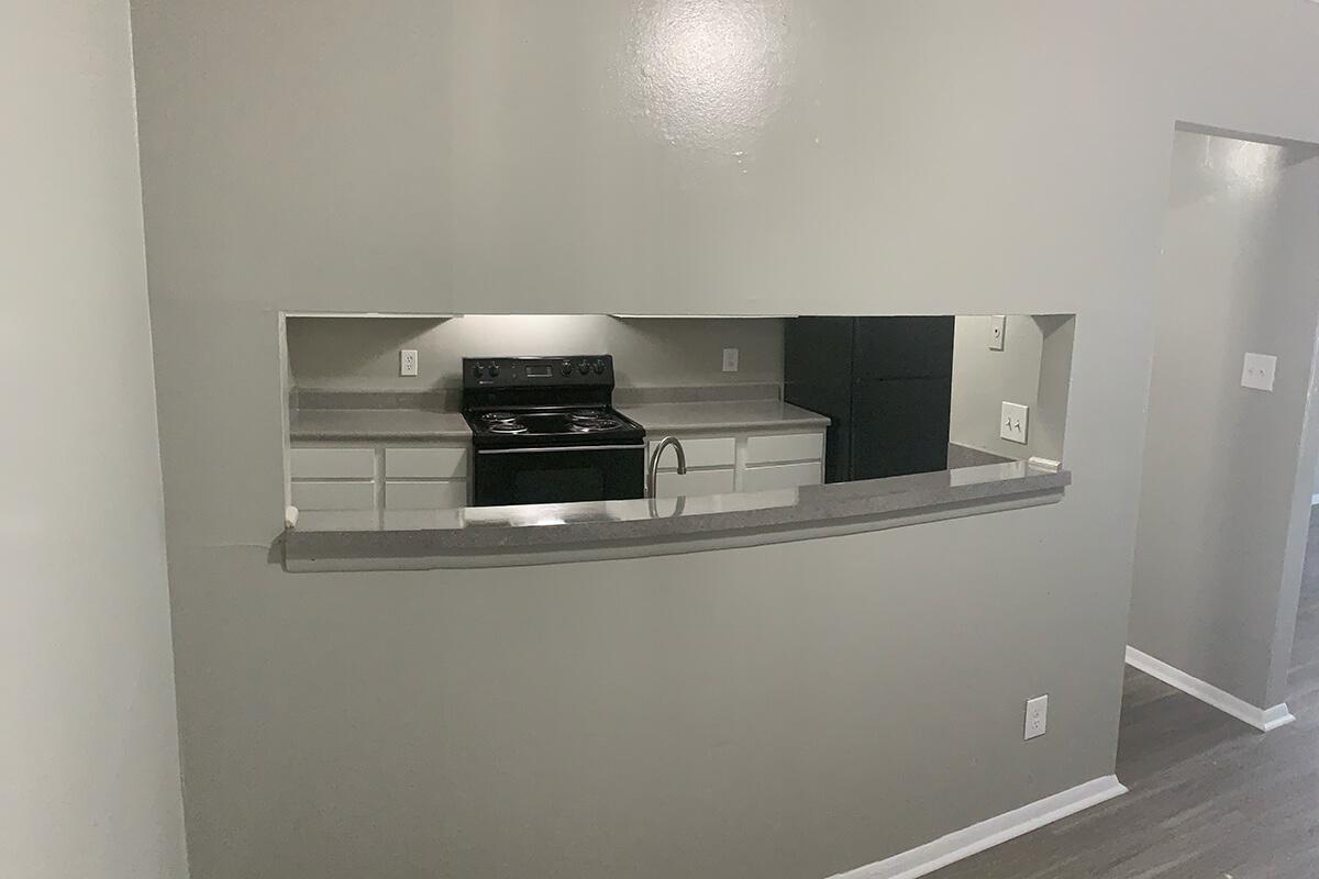 a kitchen with a sink and a refrigerator