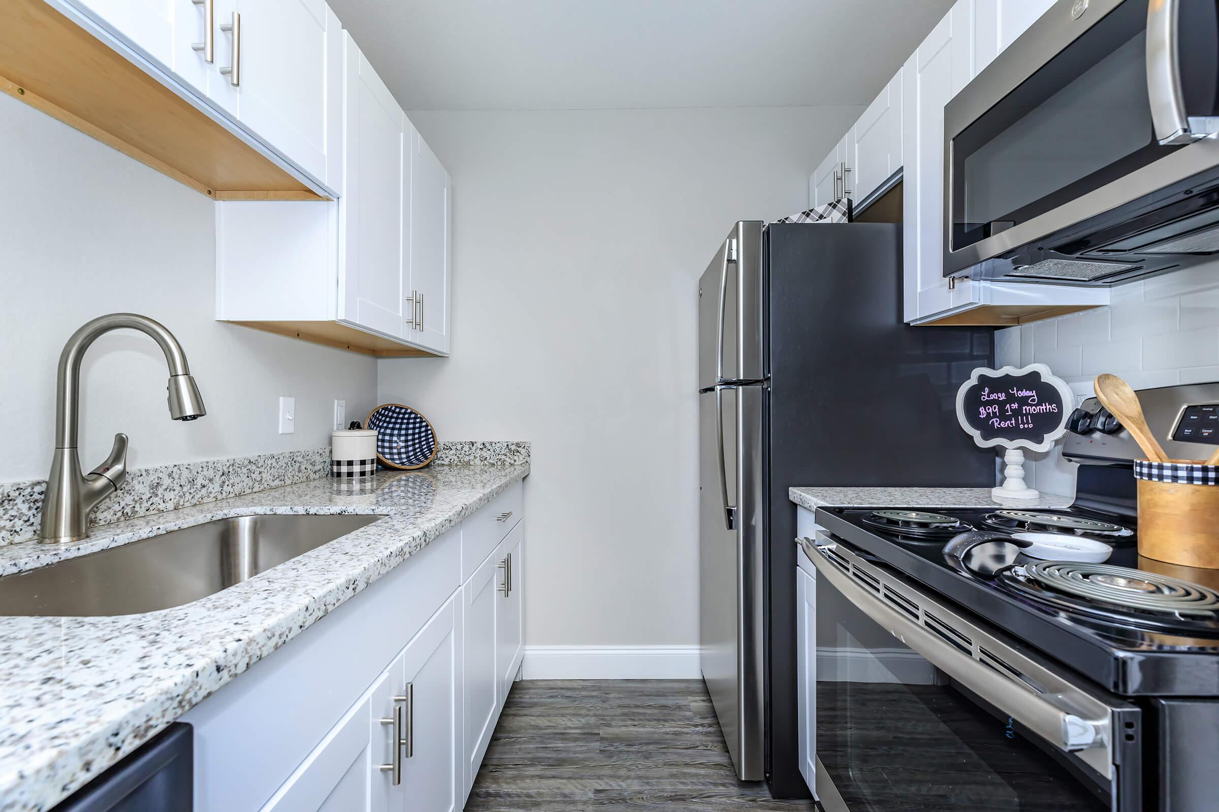 a kitchen with a stove top oven