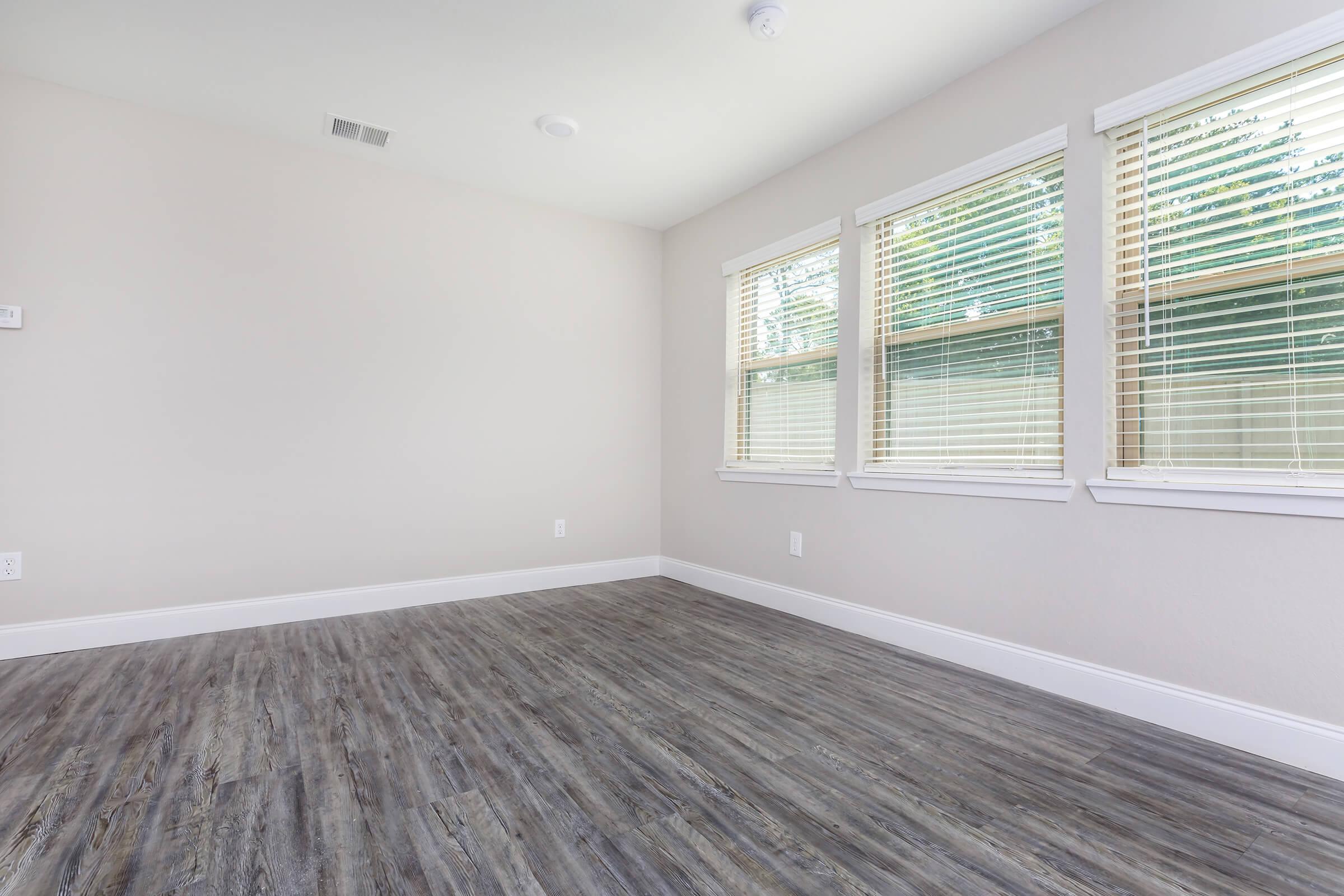 a bedroom with a large window