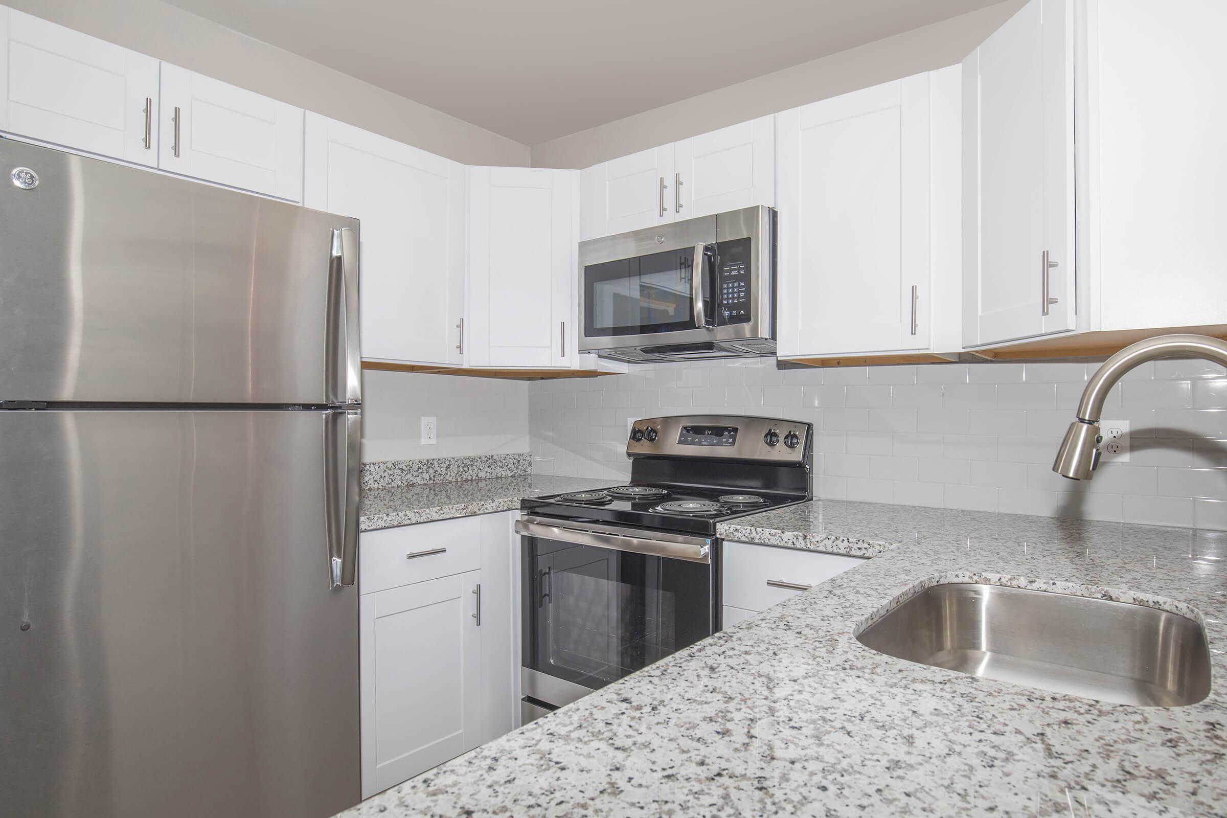 a stainless steel refrigerator in a kitchen