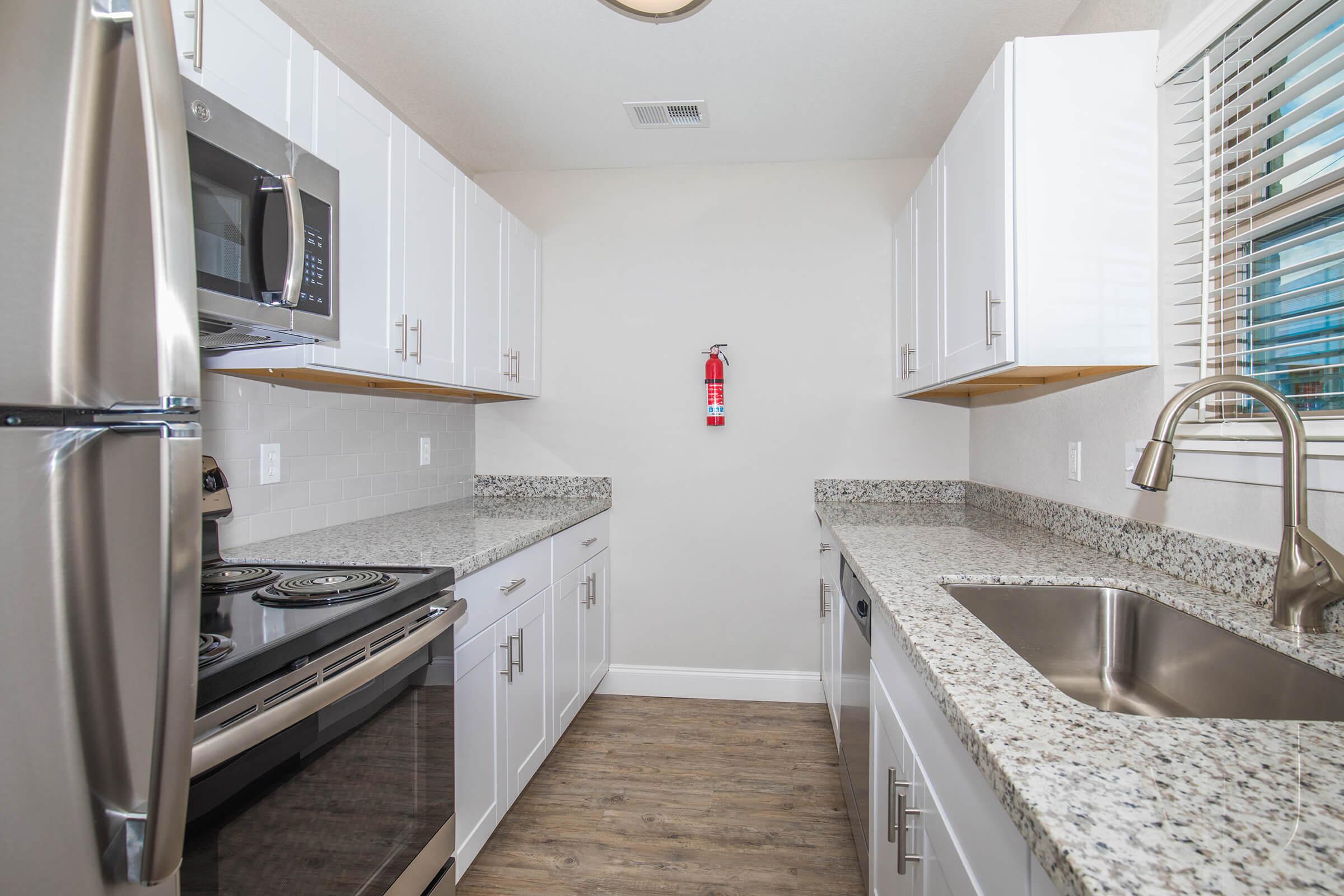 a kitchen with a sink and a window