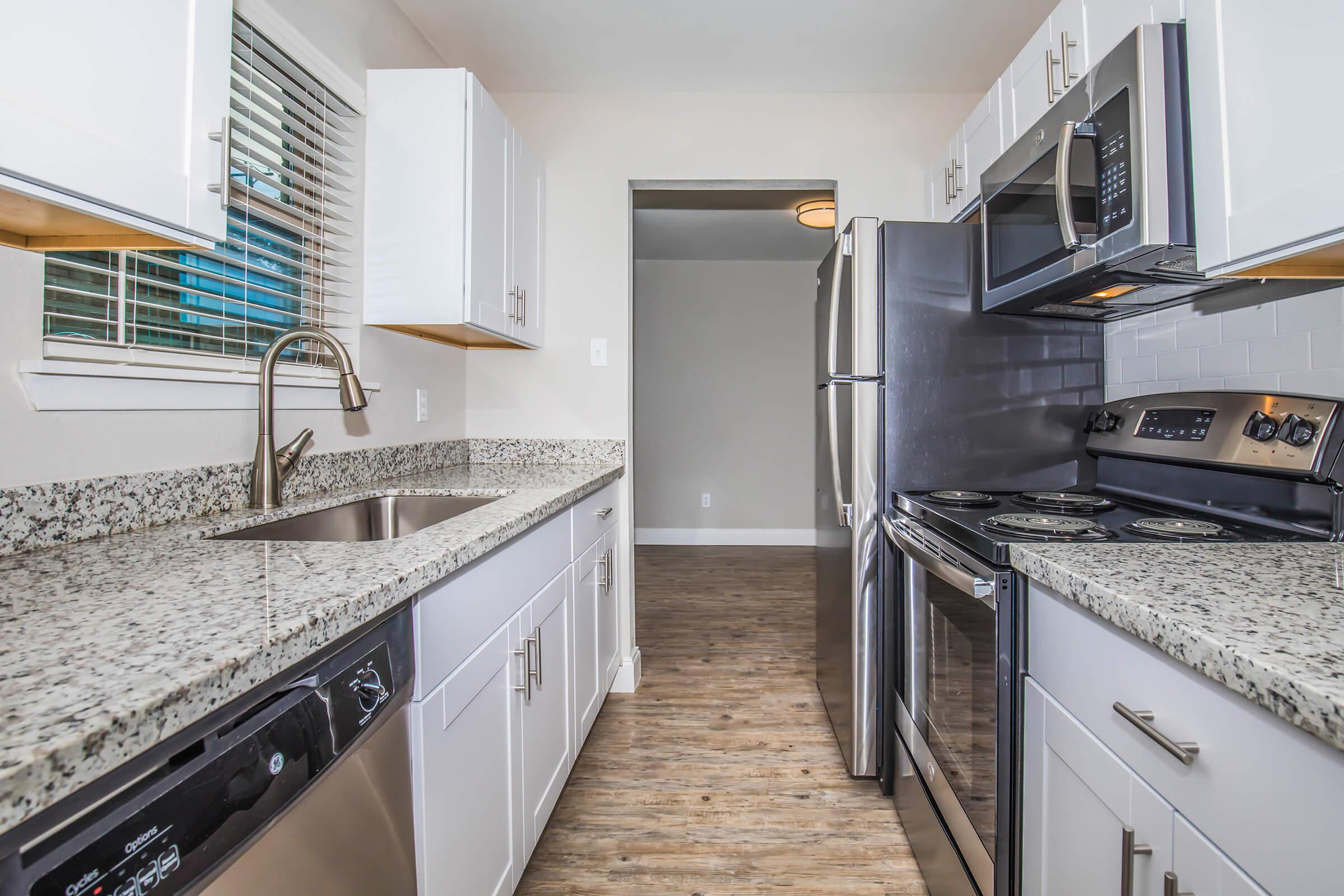 a modern kitchen with stainless steel appliances