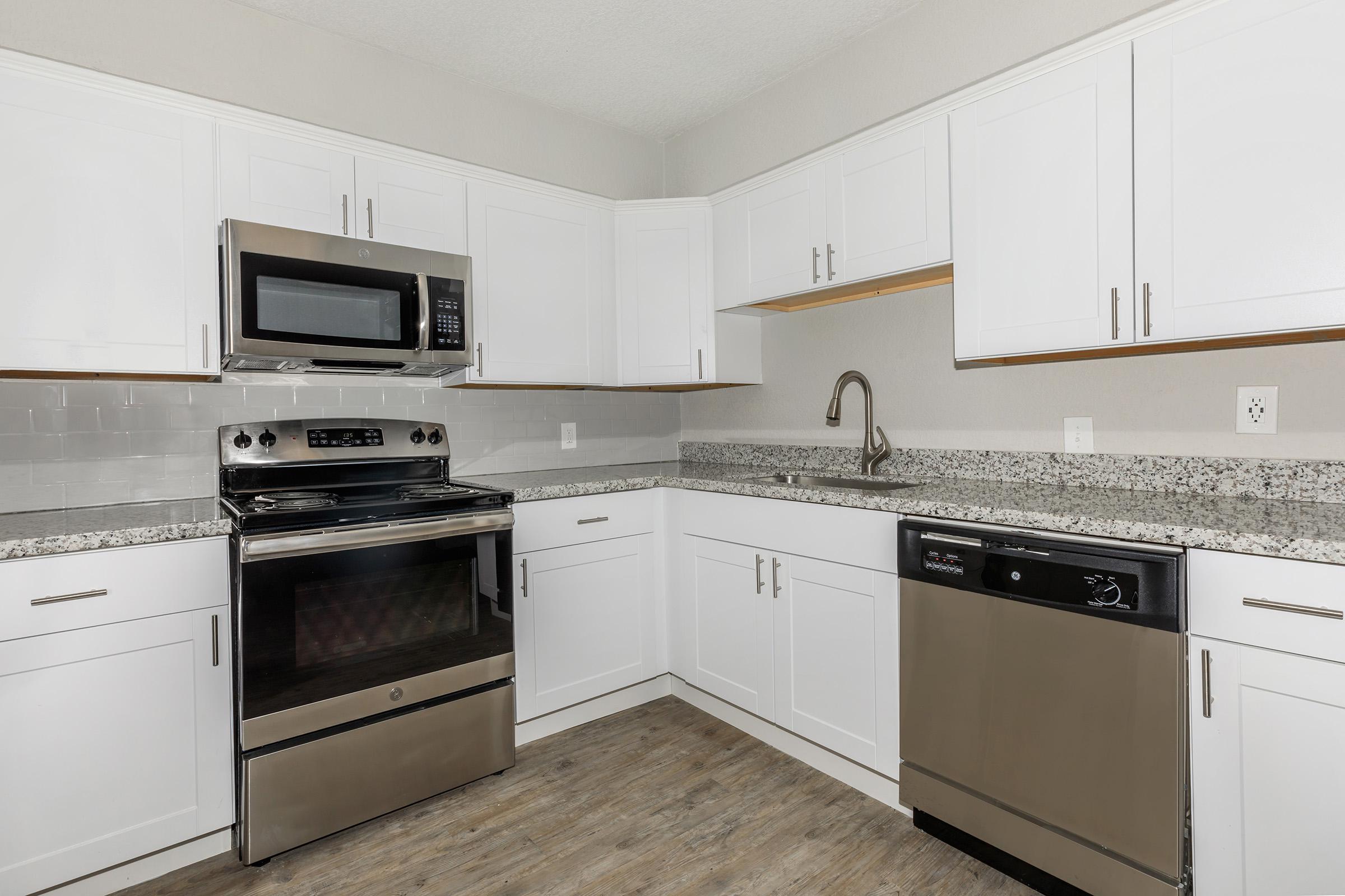 a kitchen with a stove top oven sitting inside of a refrigerator