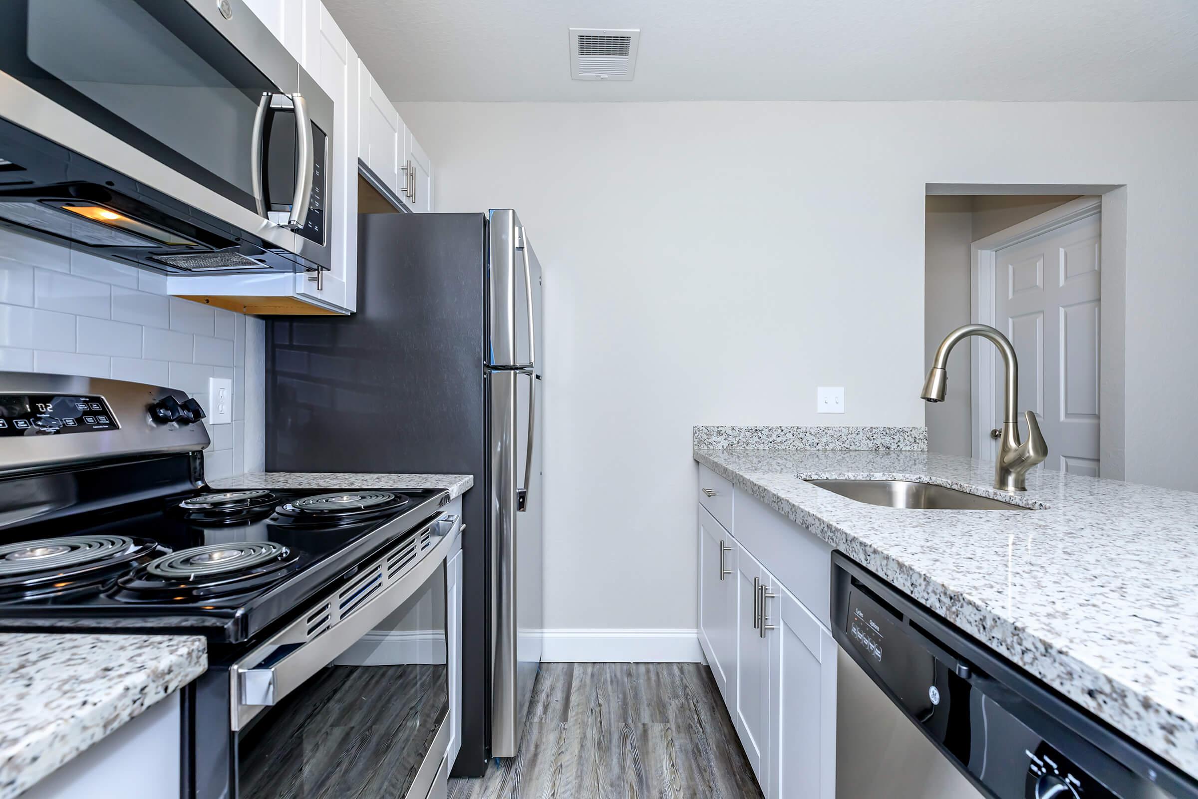 a modern kitchen with stainless steel appliances