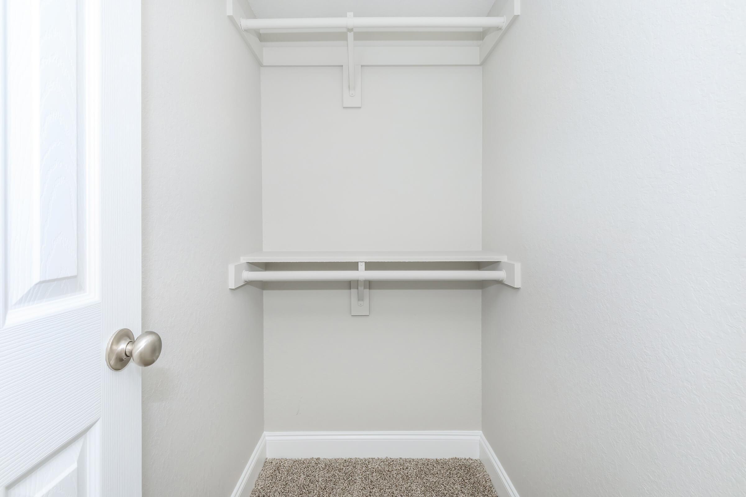 a white sink sitting next to a door