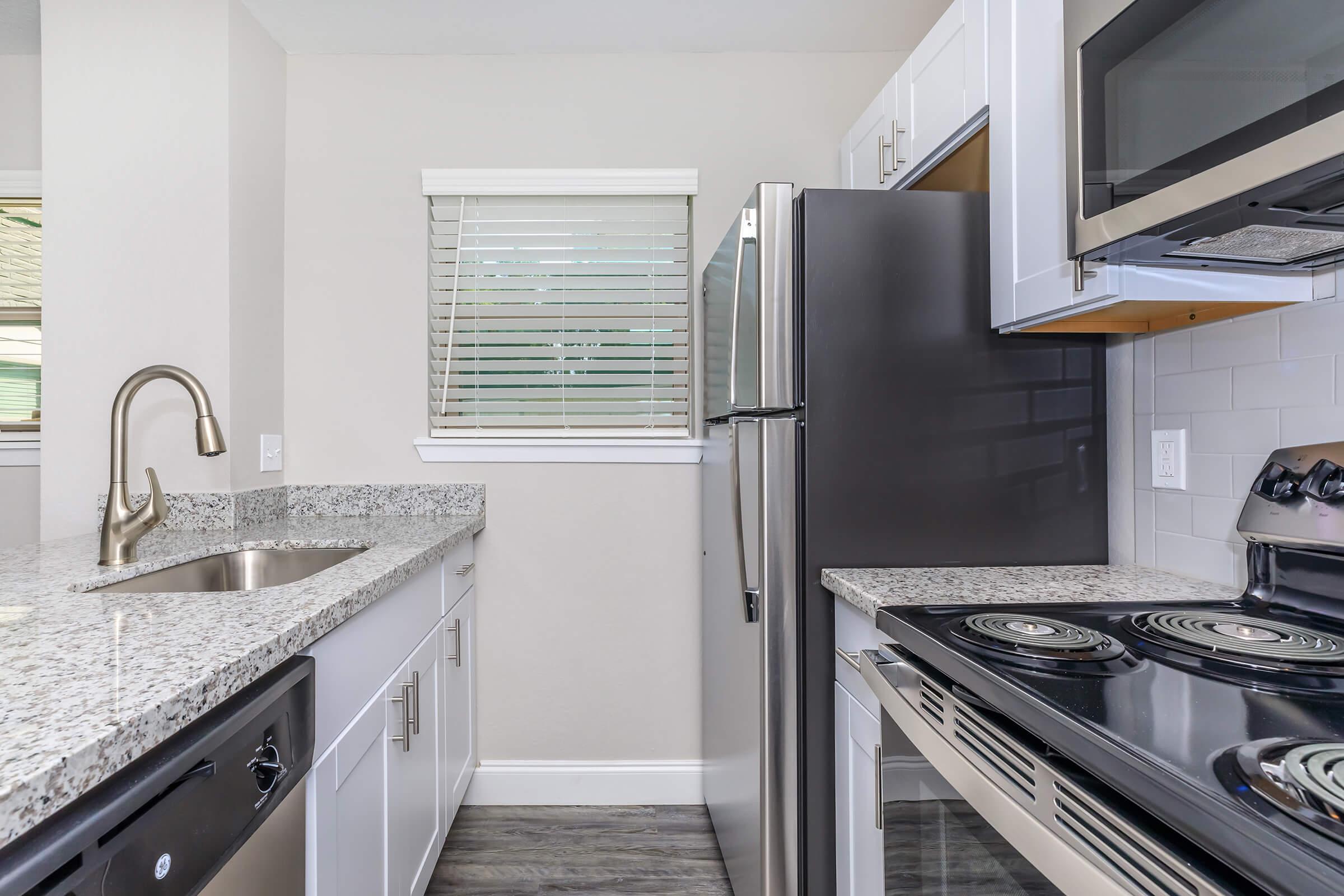 a kitchen with a stove top oven