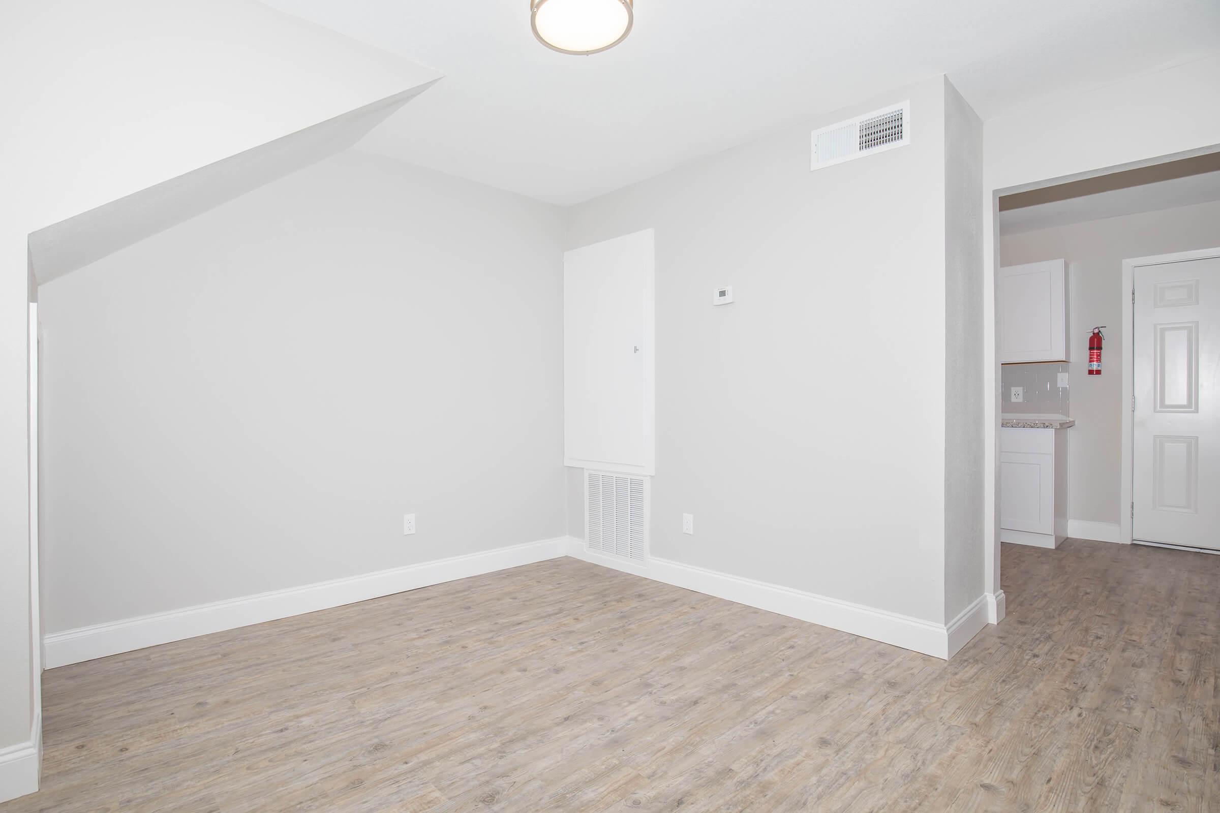 a white refrigerator freezer sitting inside of a building