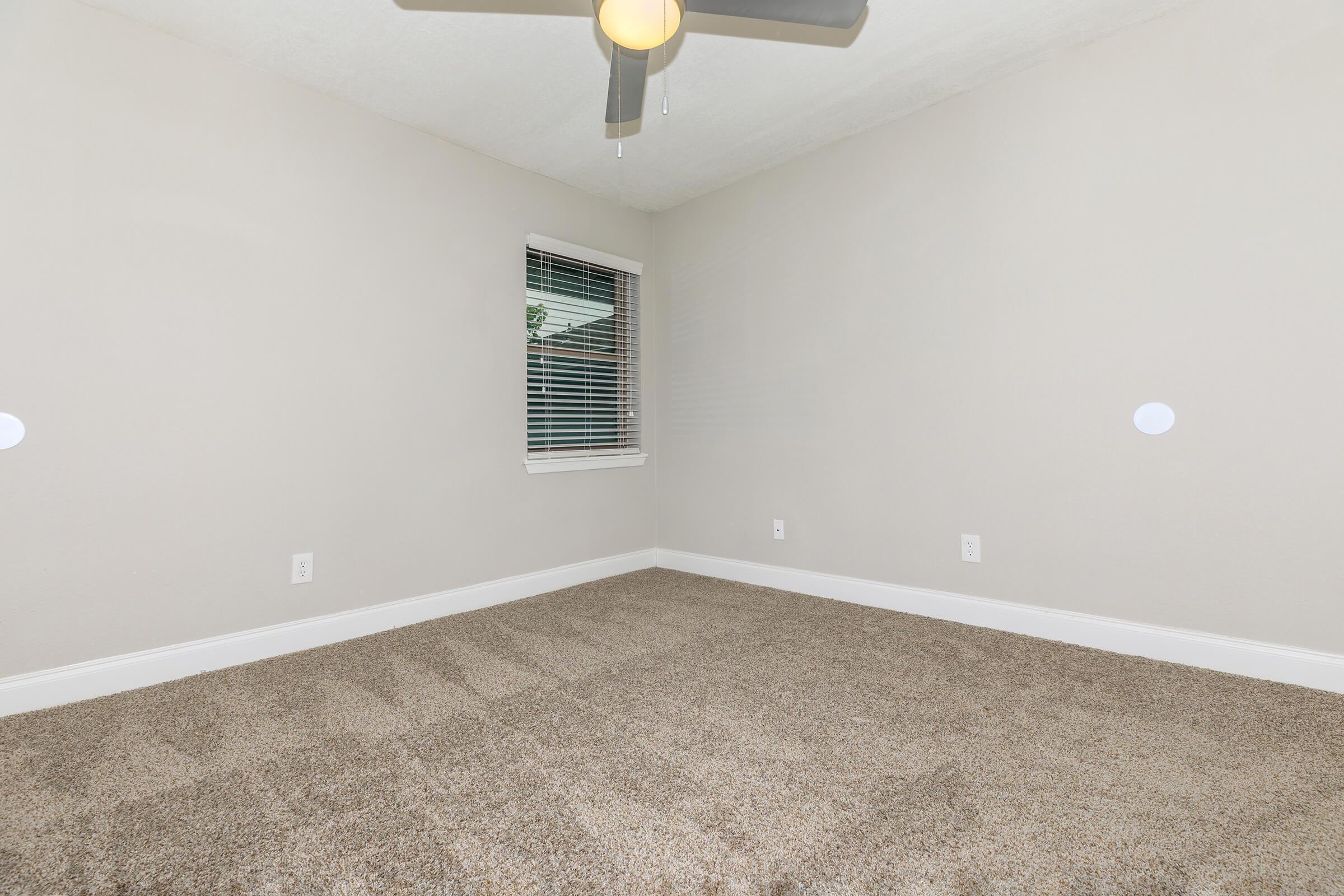 a bedroom with a large mirror