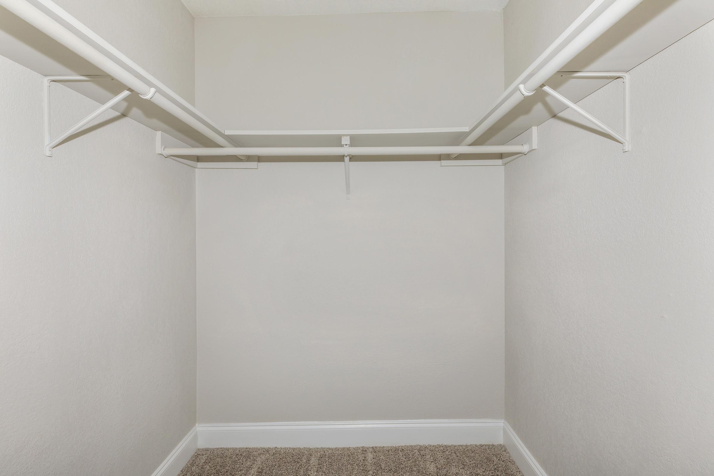 a white tub sitting next to a shower