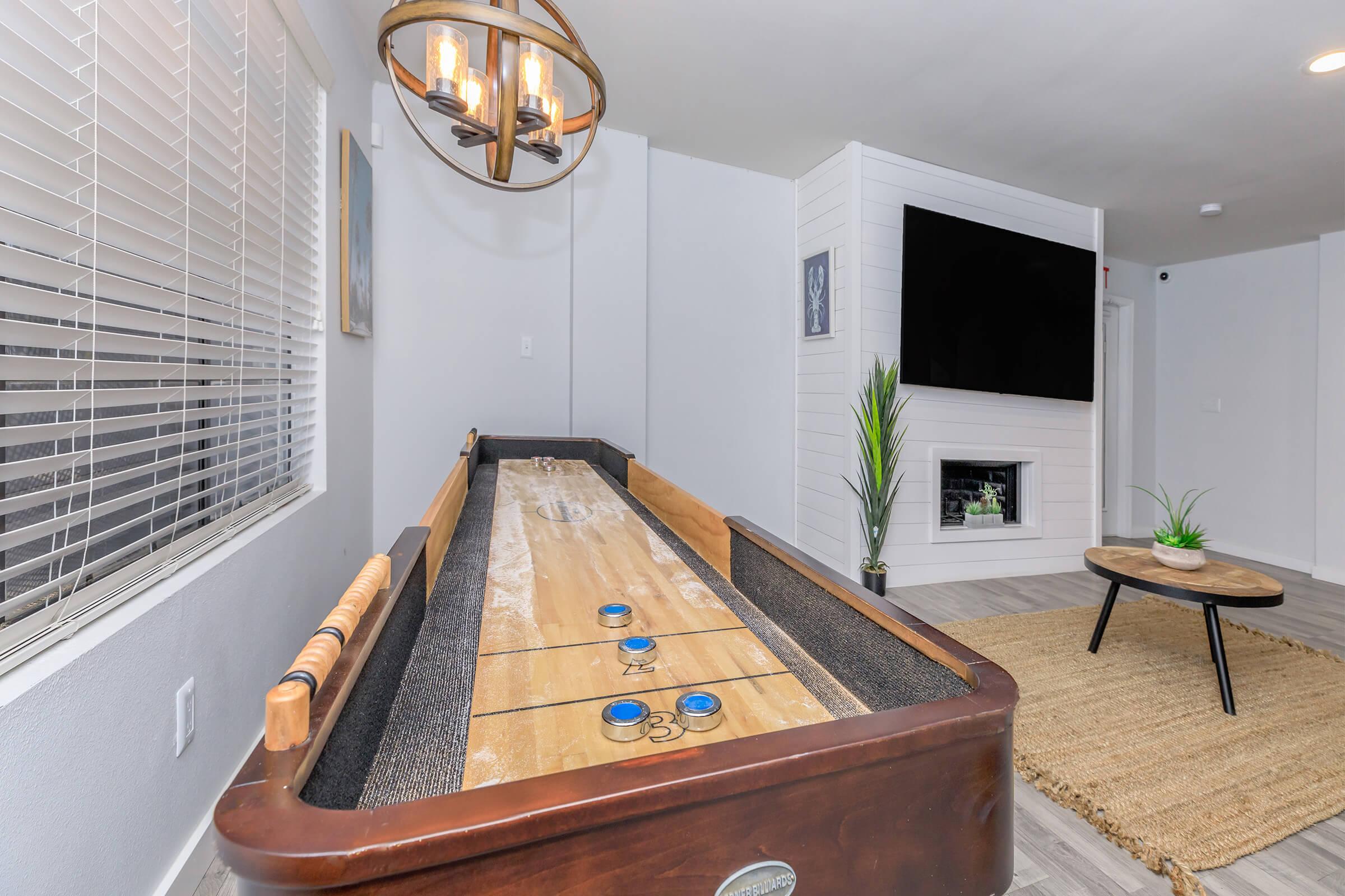 Tides on Randol East Apartments clubhouse with shuffleboard 