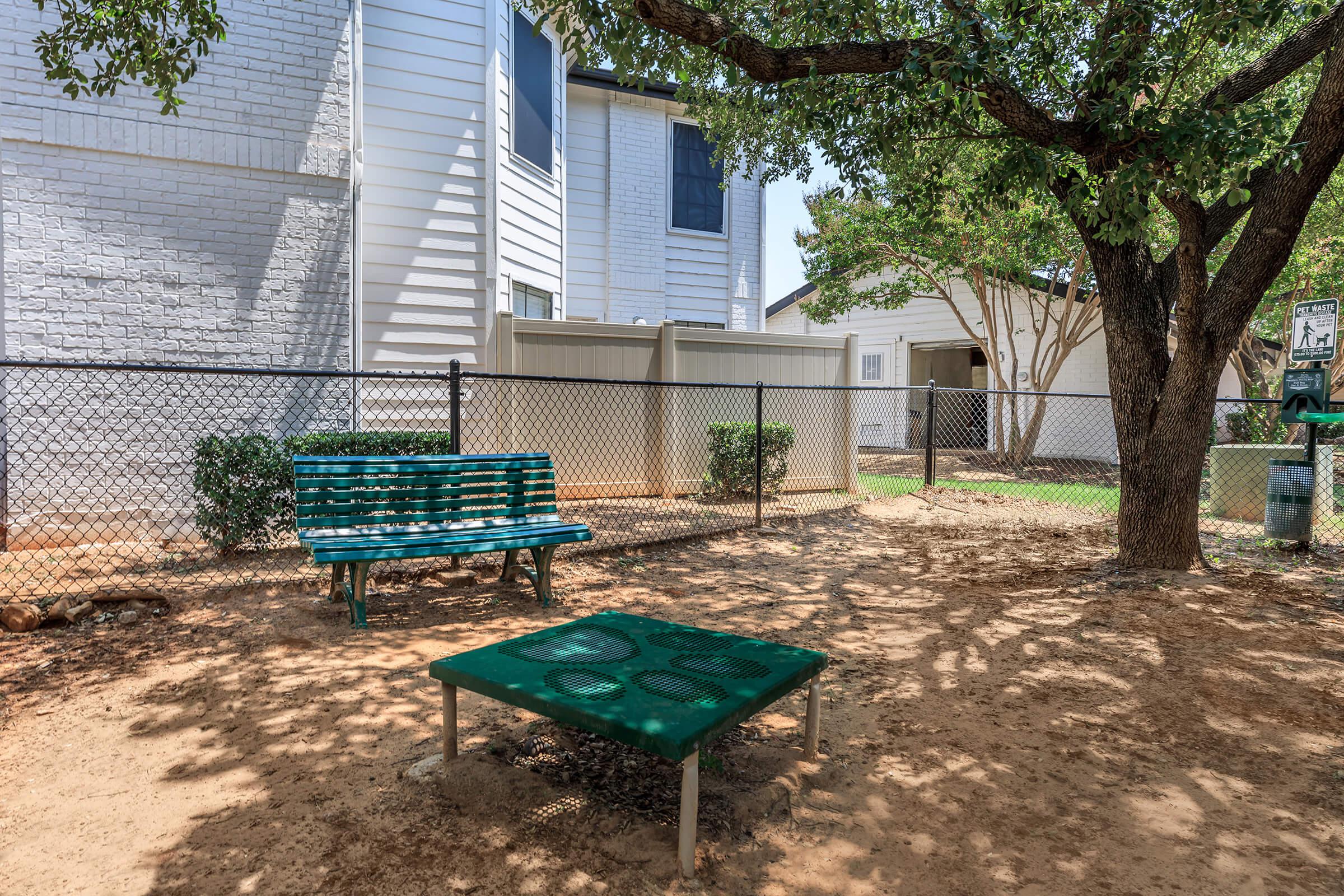 Tides on Randol East Apartments pet park with a bench