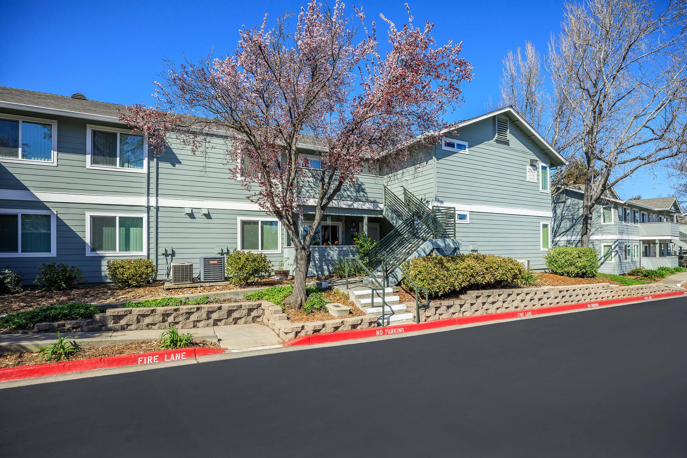 Community building with green shrubs