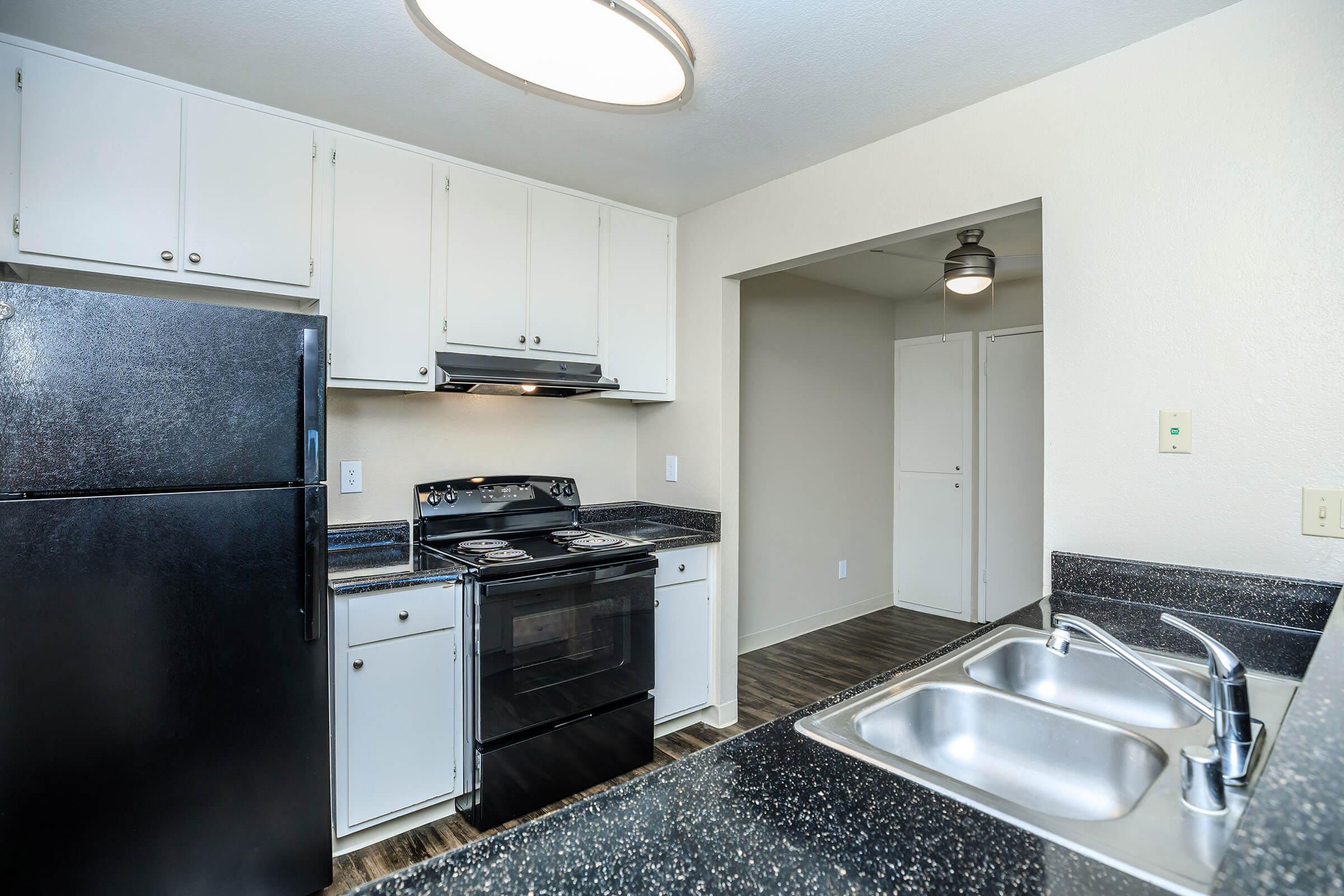 Kitchen with black countertops