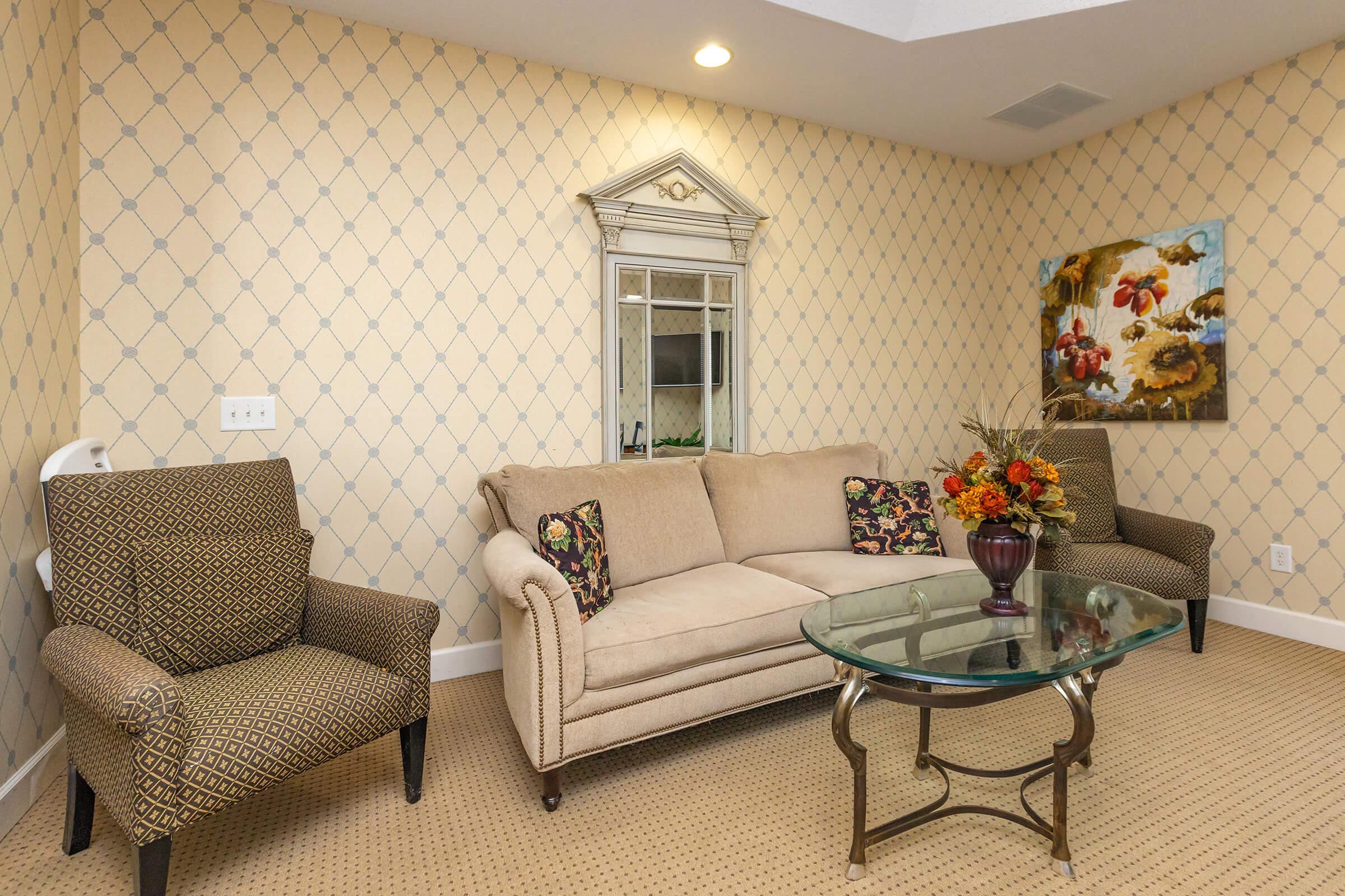 a living room with a couch and a chair