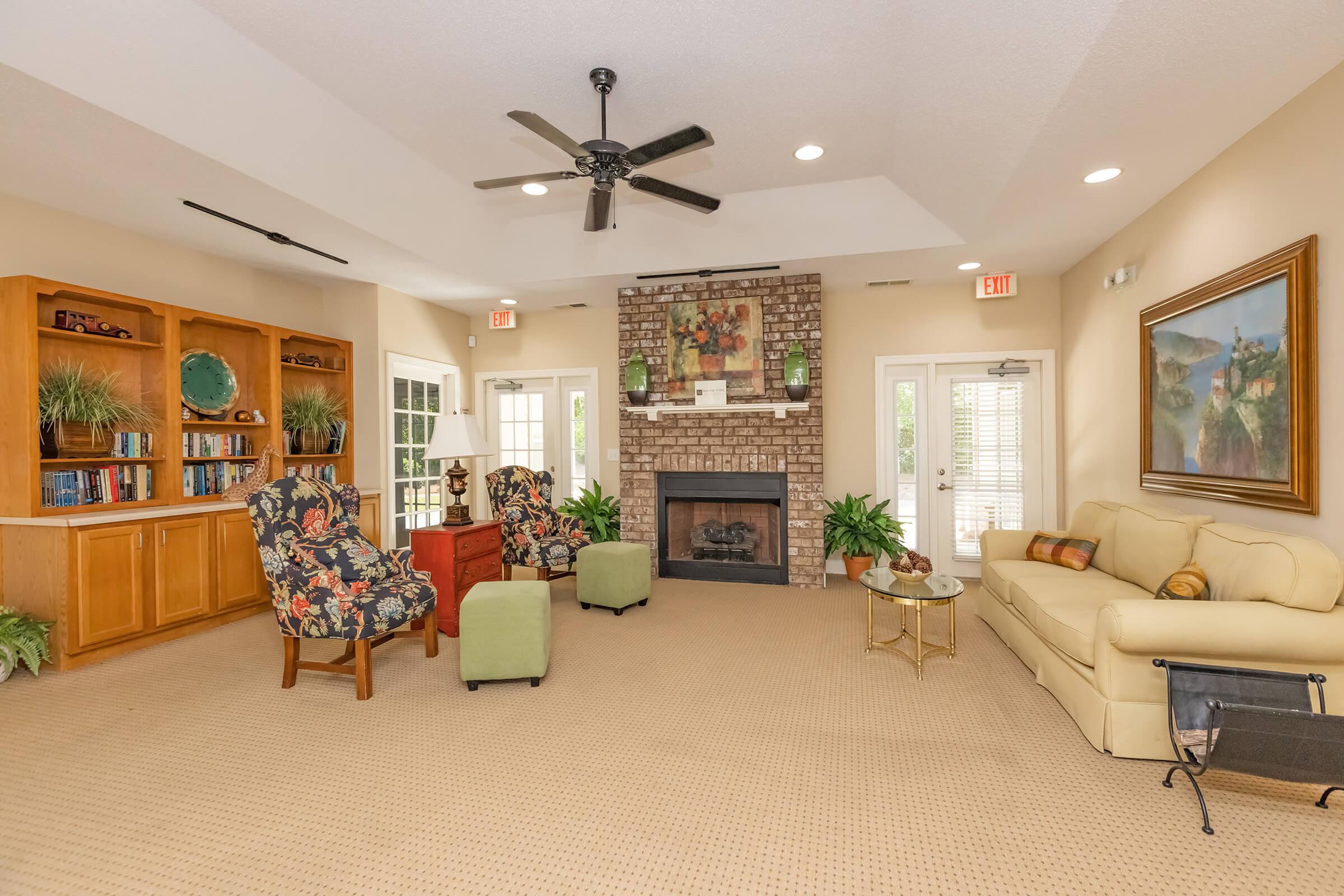 a living room filled with furniture and a fireplace