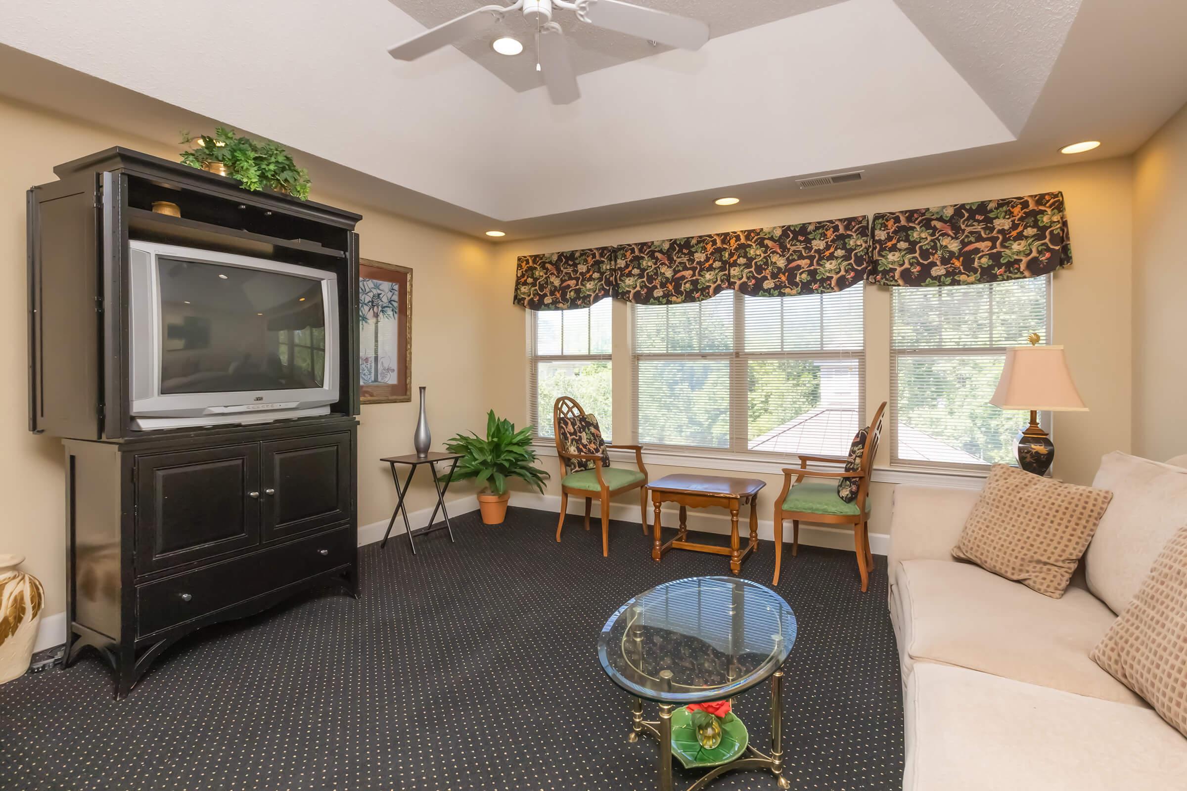 a living room filled with furniture and a fireplace