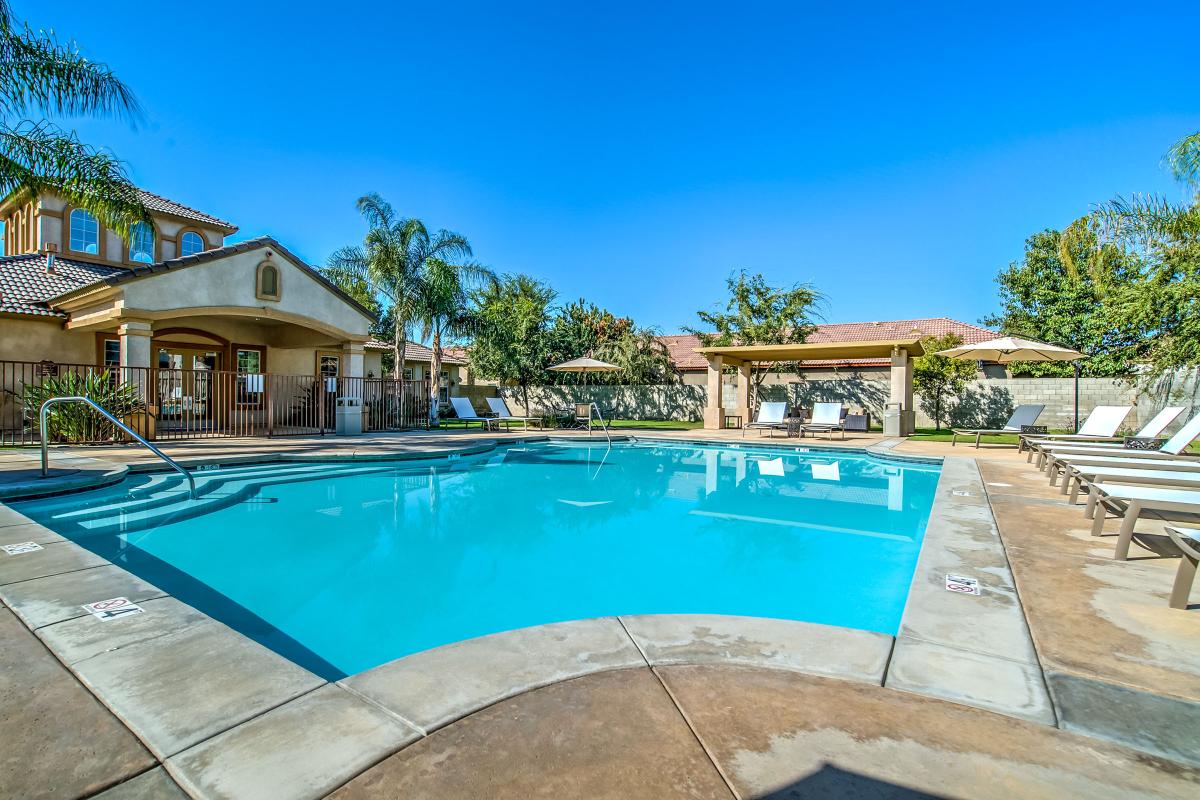 The community pool with a pergola