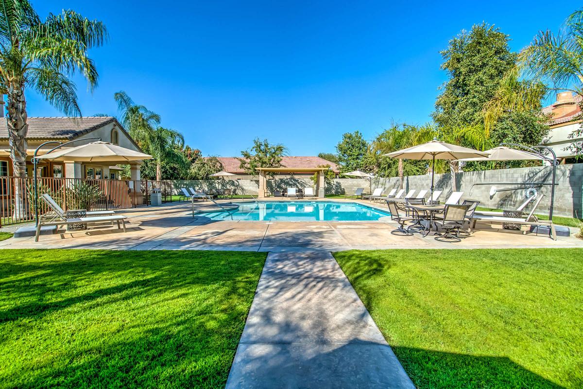 The community pool with green grass