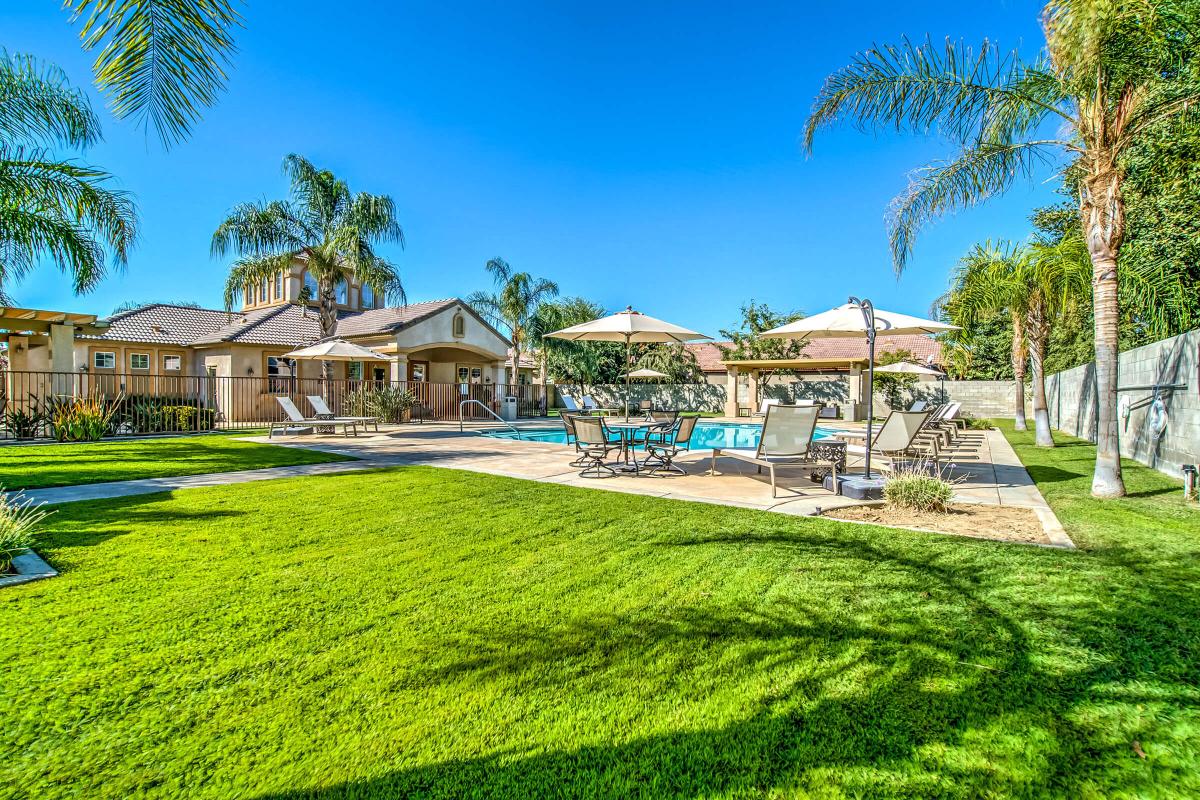 Jasmine Parke Apartments community pool with green trees