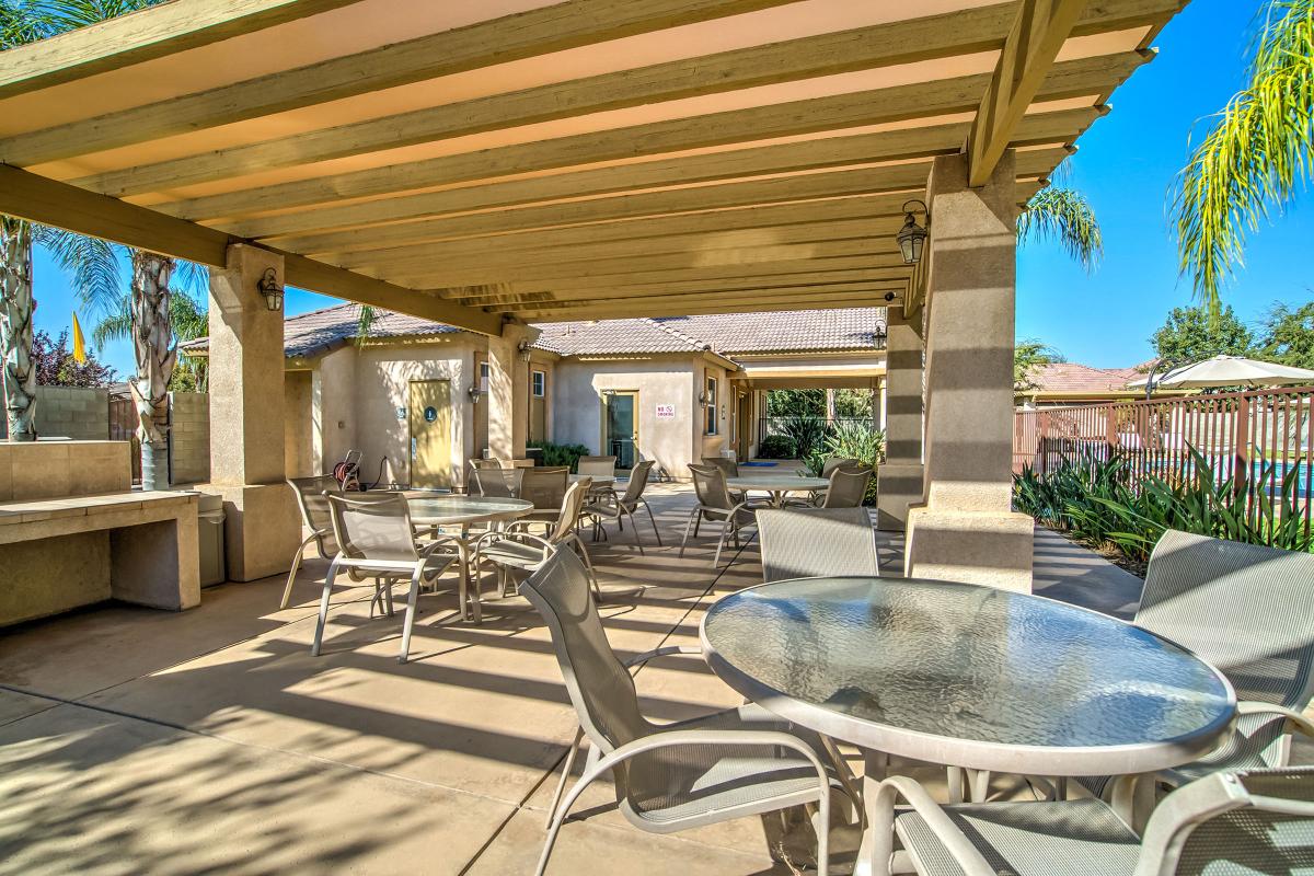 Tables and chairs under a pergola