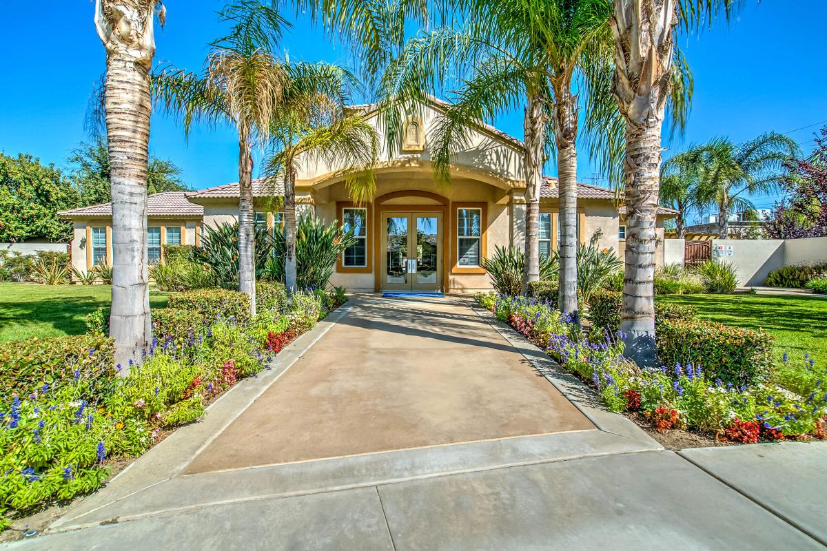 Leasing office entrance with green plants