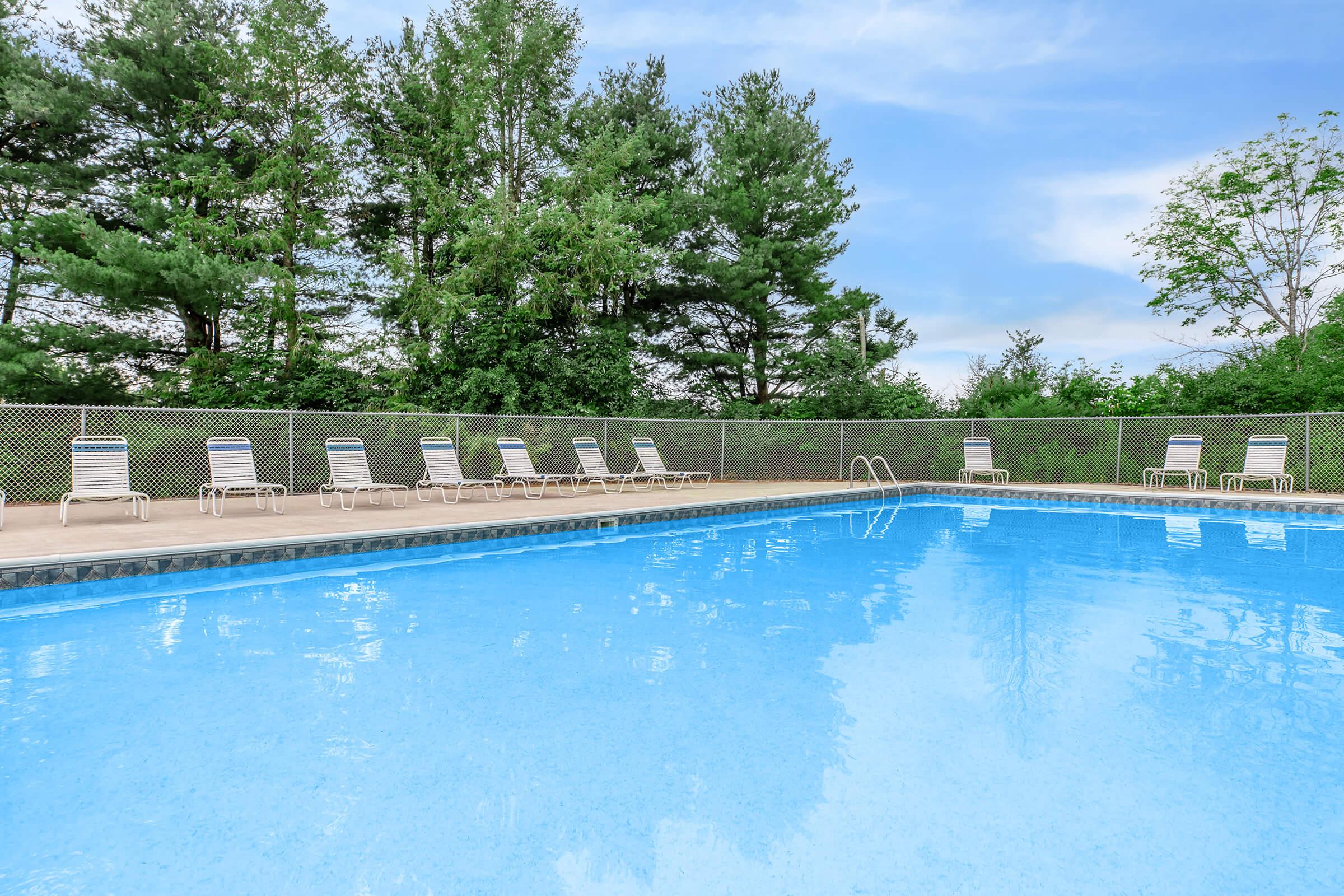 a pool next to a body of water