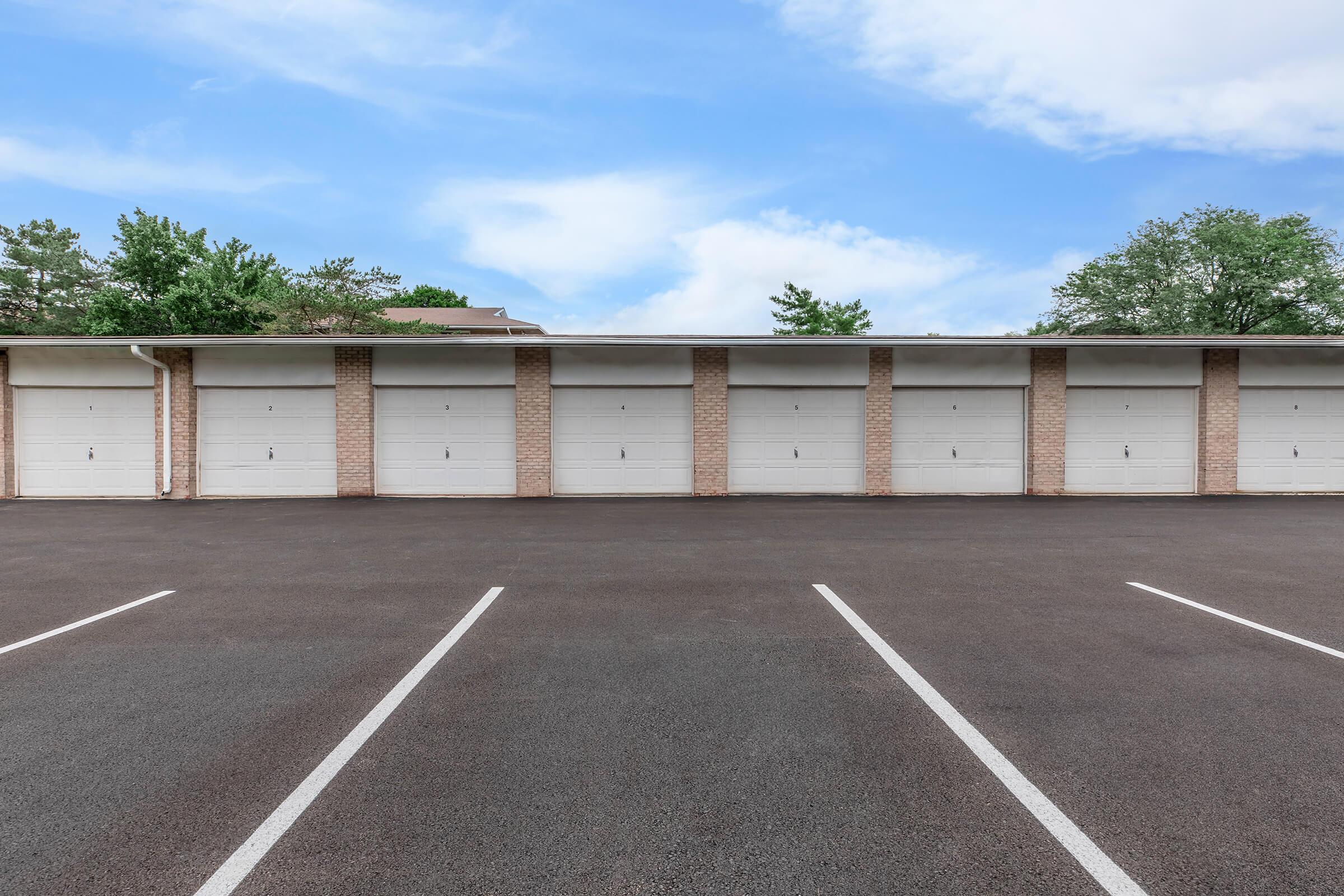 an empty parking lot in front of a building