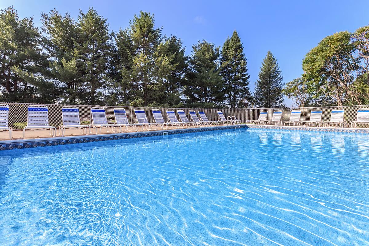 a pool next to a body of water