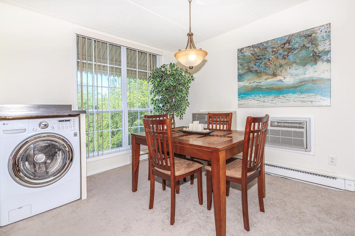 a room filled with furniture and a fire place sitting in a chair